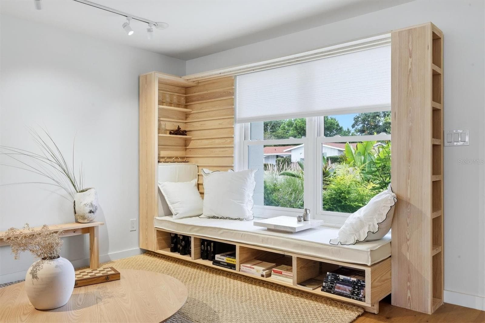On the right side, the living/family room begins with a beautifully hand-crafted window seat. - 2513 CROTON AVE, SARASOTA