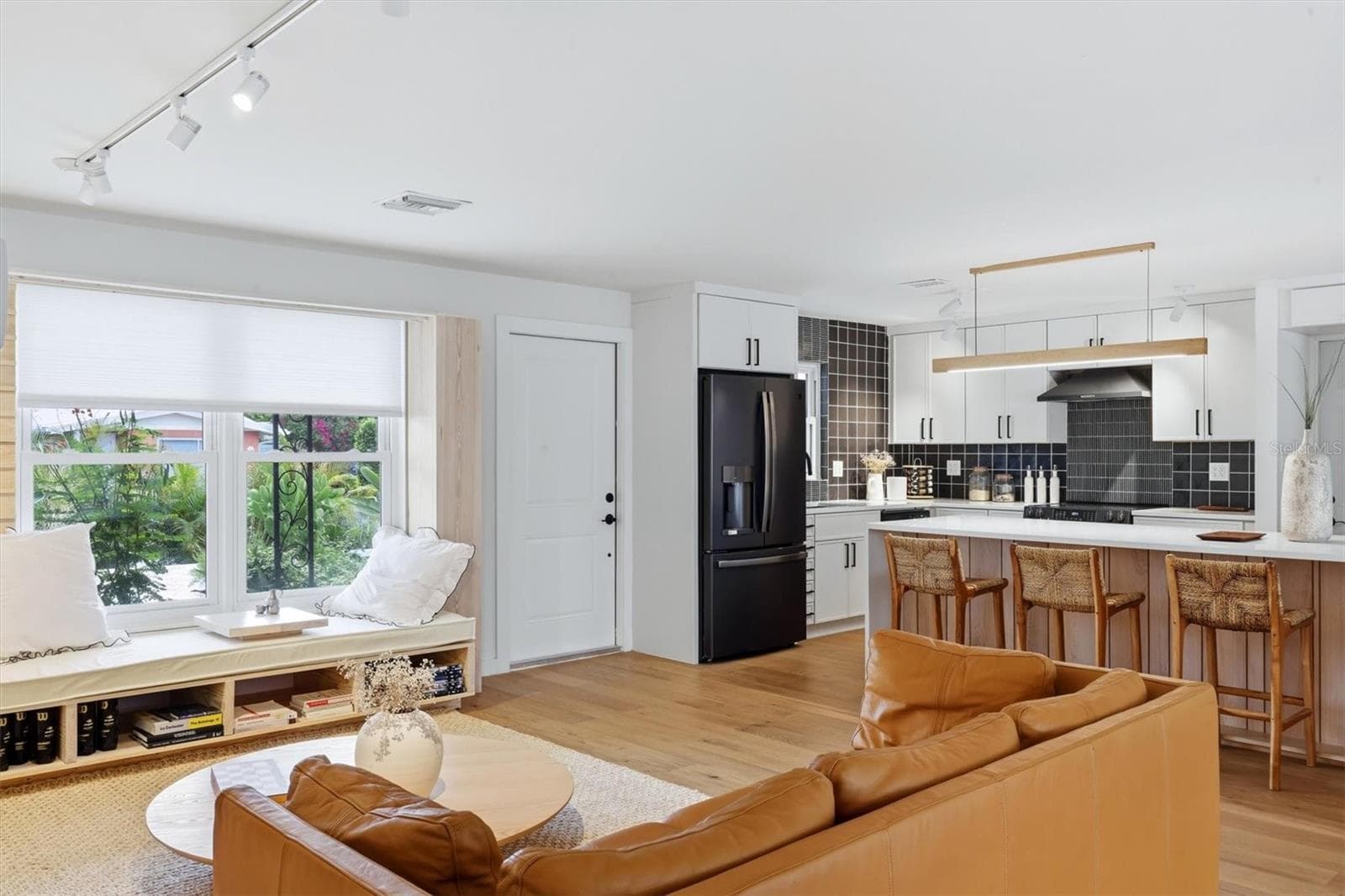 Step into the home through the front entrance and to the left see a brand new open kitchen with a ceramic and stone backsplash, quartz countertops, all new appliances - 2513 CROTON AVE, SARASOTA