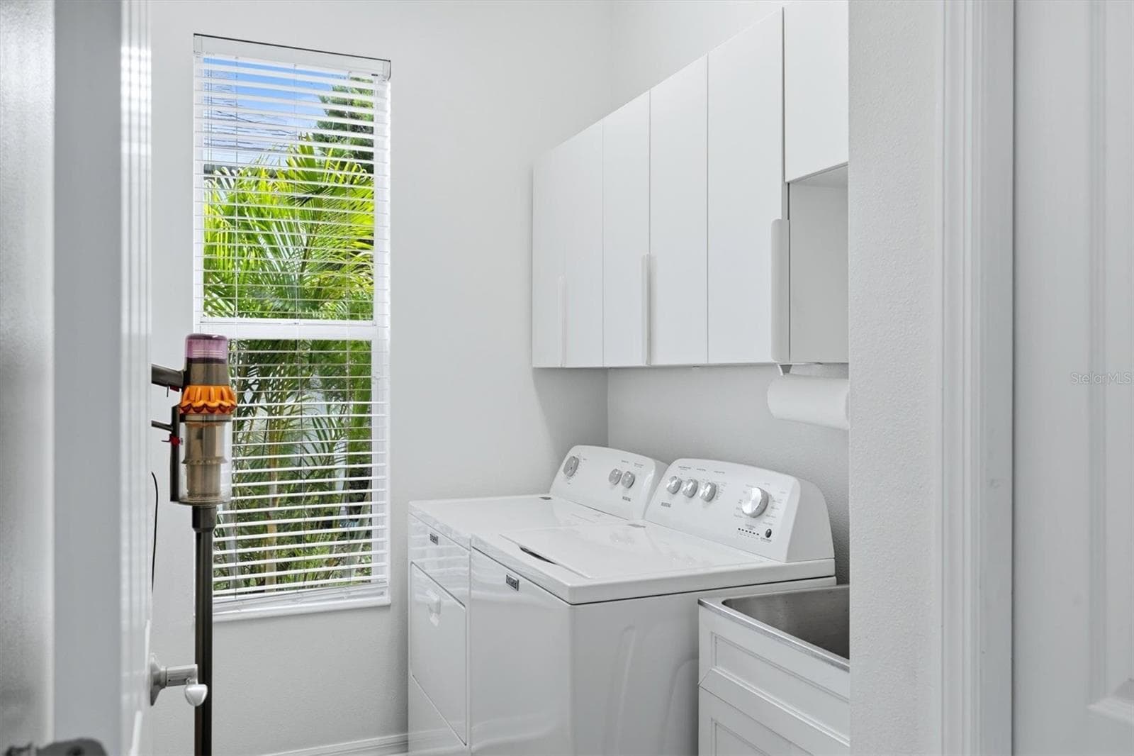 Laundry with storage and new appliances - 5847 LEXINGTON DR, PARRISH