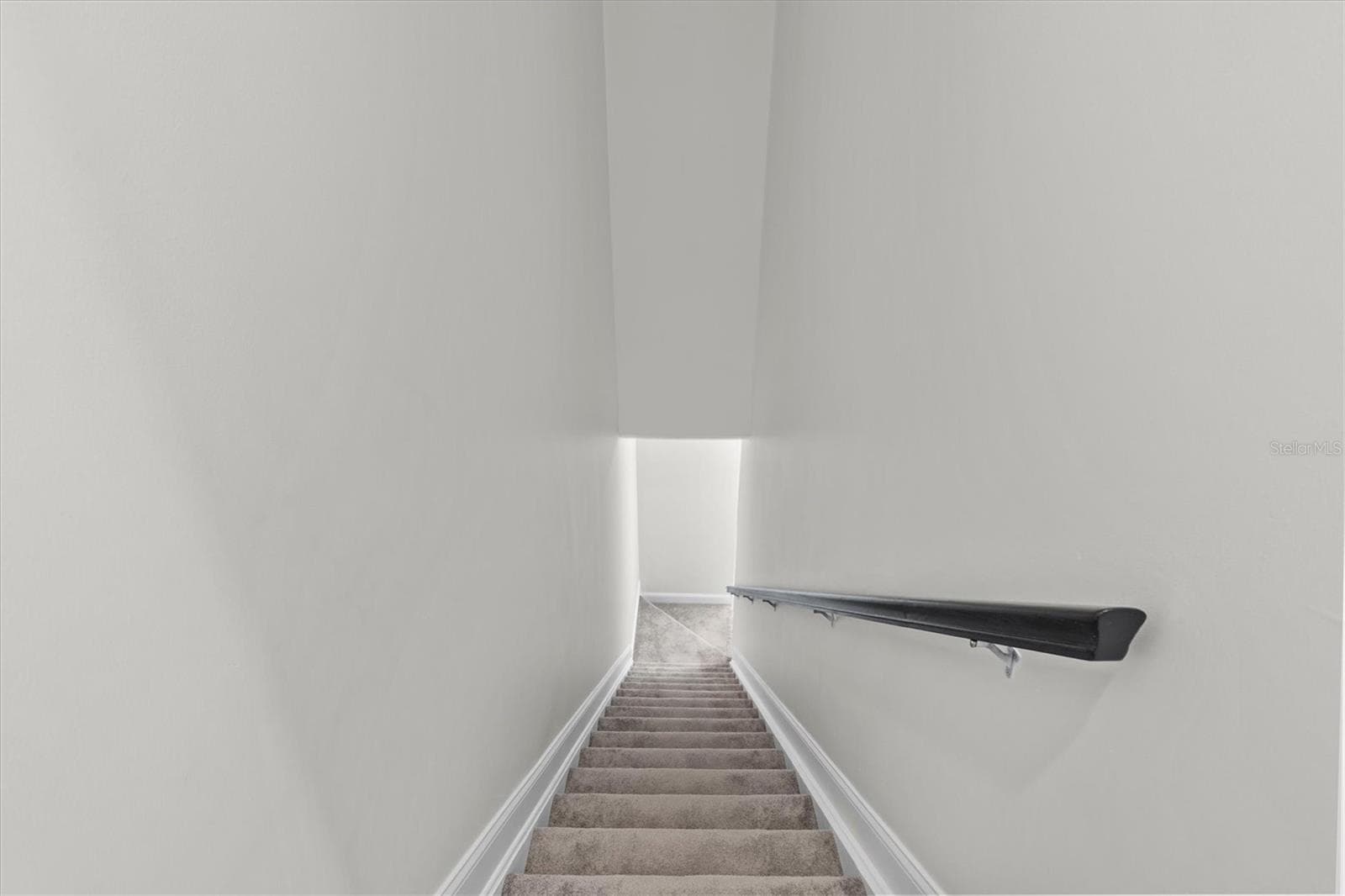 Stairs from garage to in-law suite. - 480 GILMAN PL N, ST PETERSBURG