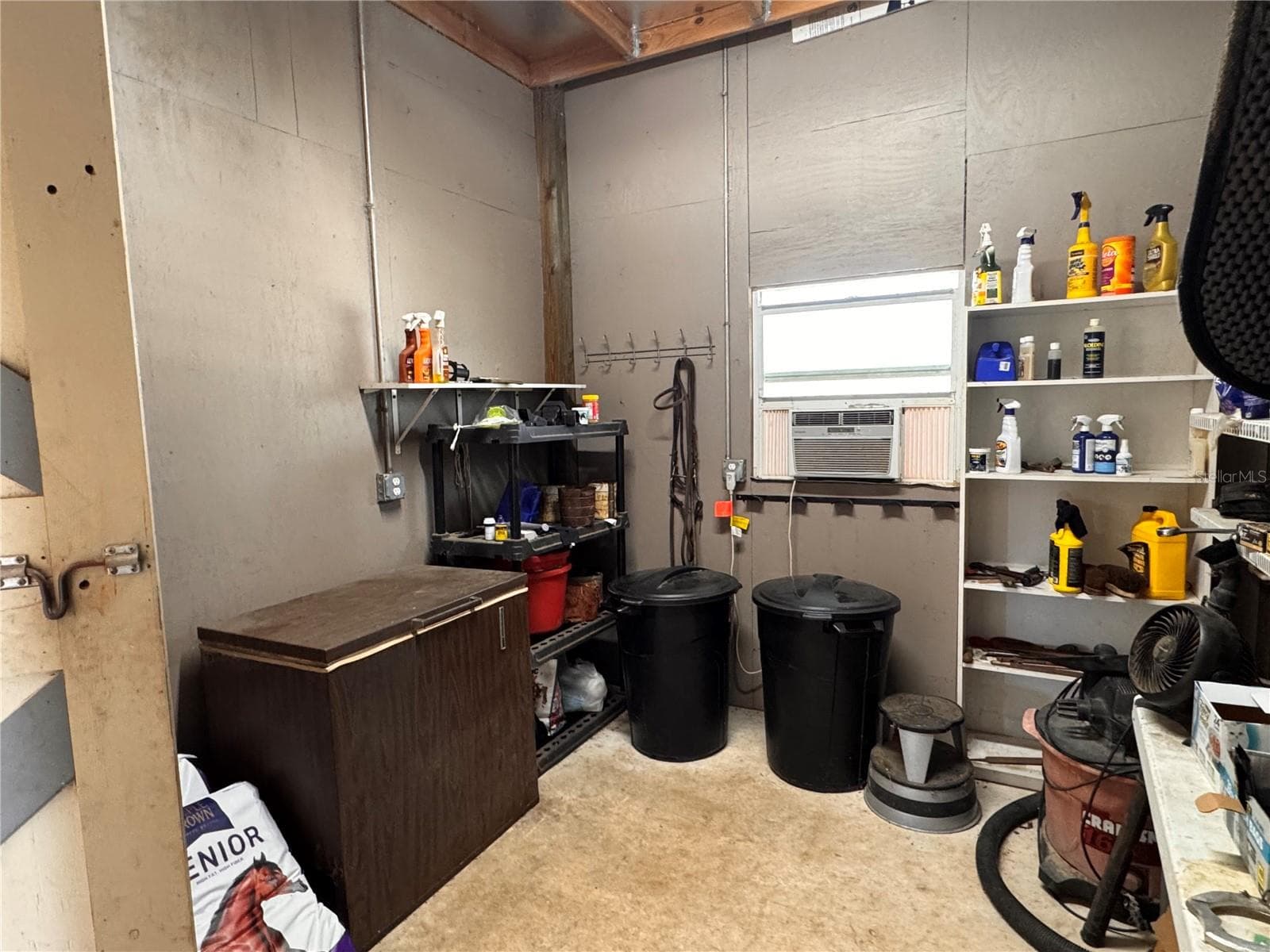 Dedicated tack and feed room provides conveneint storage for equestrian essentials - 6722 W SENTINEL BLUFF PATH, BEVERLY HILLS