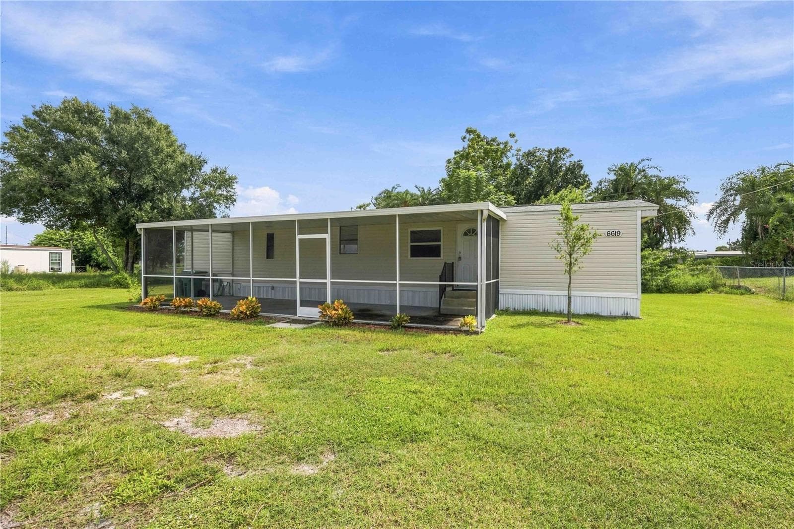 Manufactured Home at 6619 ORANGE BLOSSOM LN, PUNTA GORDA, photo 4 of 46