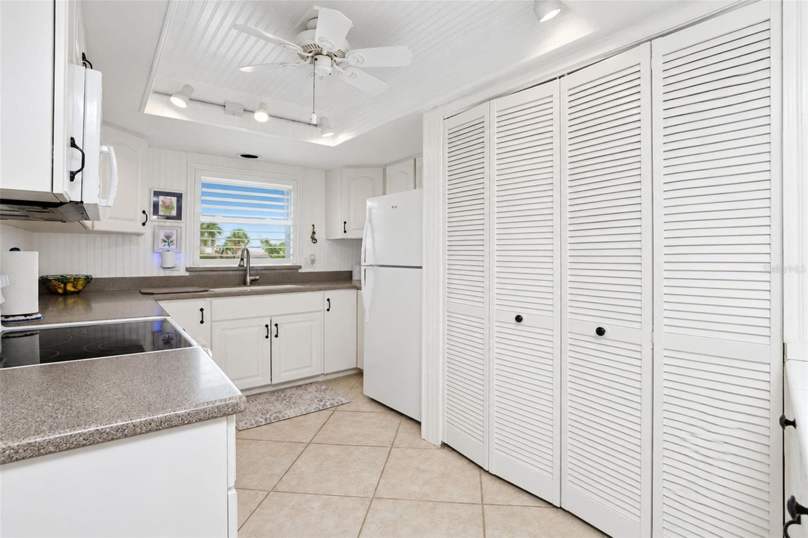 Kitchen with storage closet - 2700 N BEACH RD #A105, ENGLEWOOD
