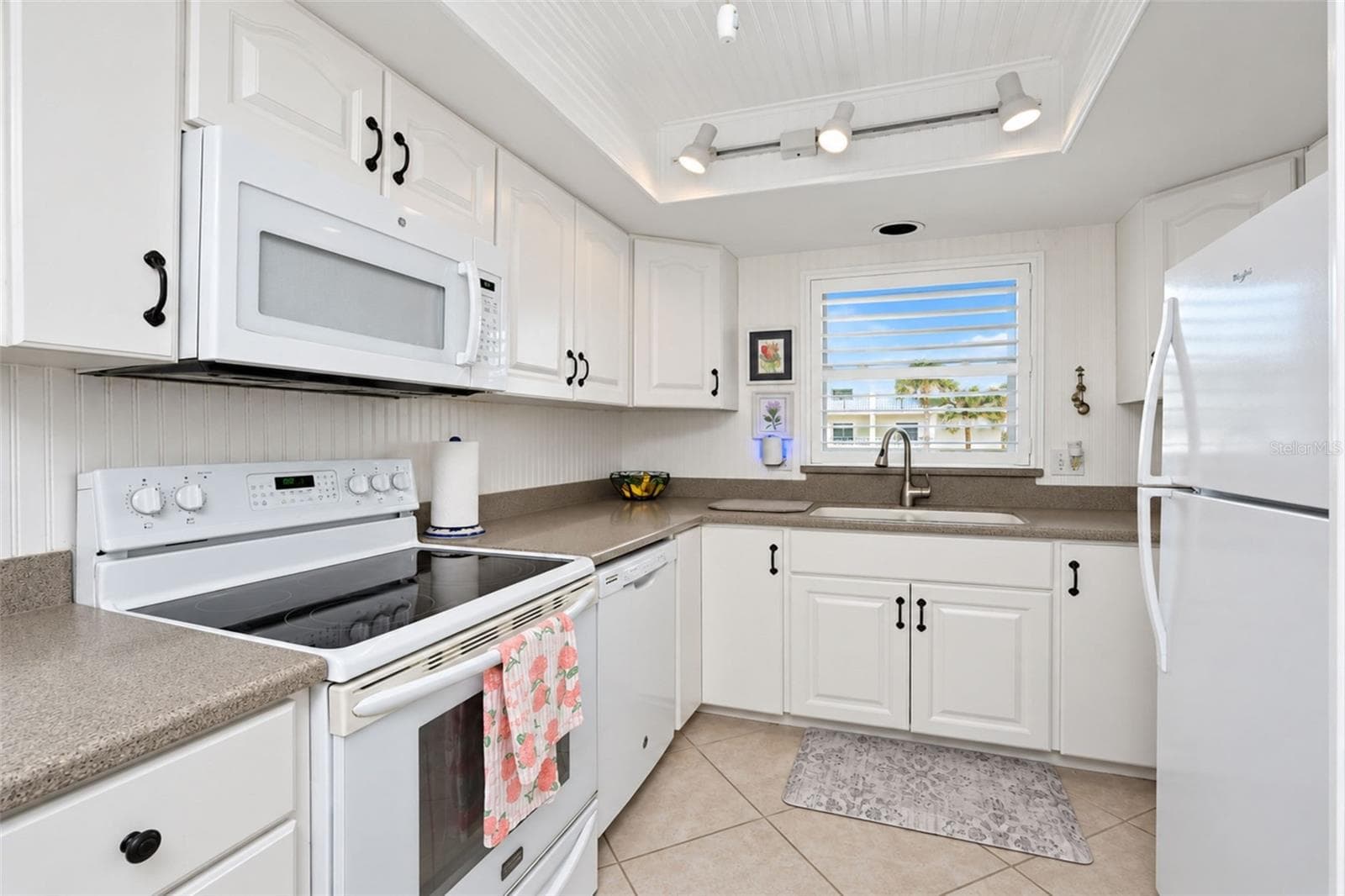 Kitchen with views of Gulf from window - 2700 N BEACH RD #A105, ENGLEWOOD