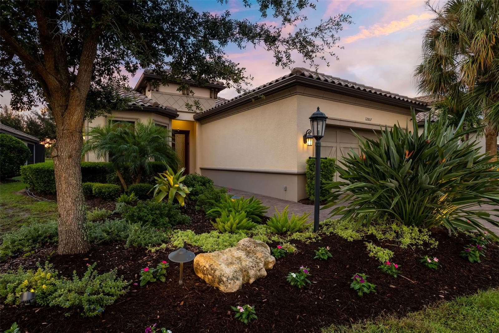 Lush, professionally landscaped front yard - 12807 SORRENTO WAY, BRADENTON