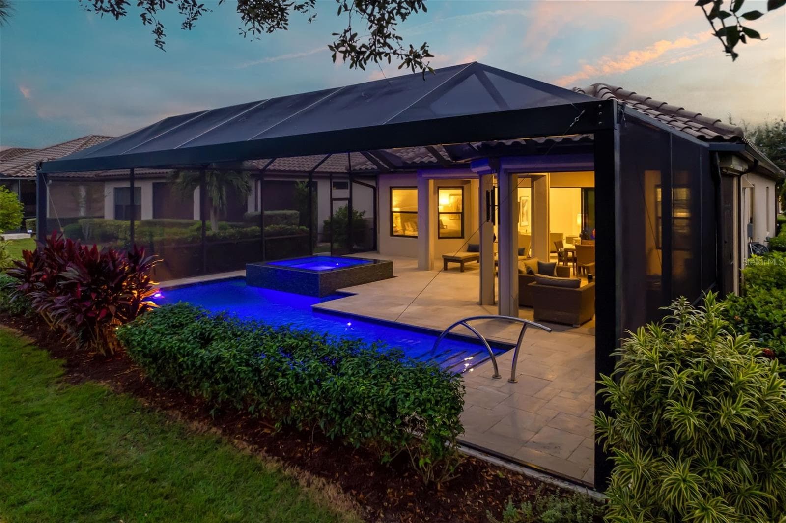 The surface of the lanai is sealed Travertine rectangular pavers of various sizes - 12807 SORRENTO WAY, BRADENTON