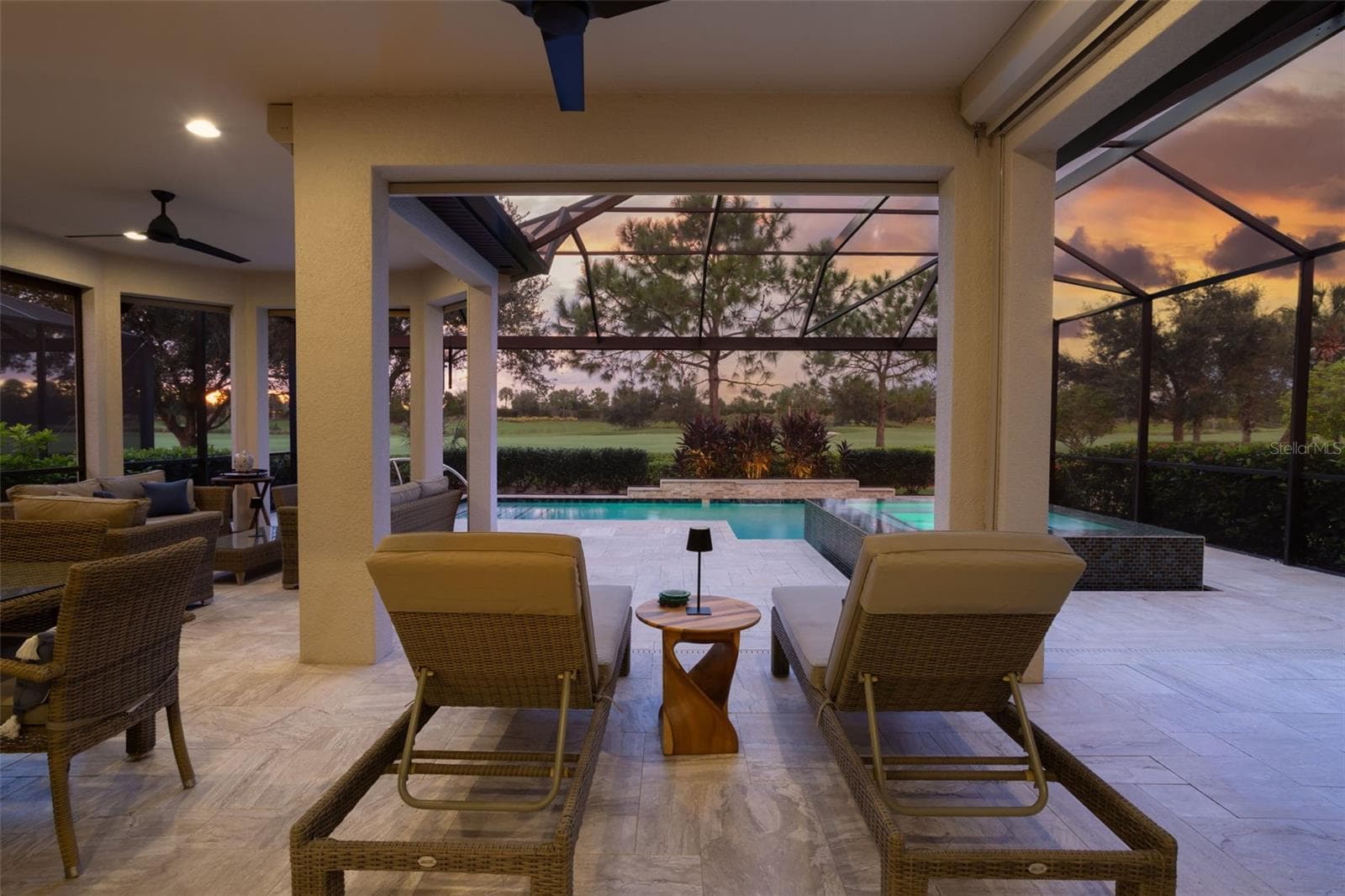 Another seating area offering a serene spot in which to relax and enjoy the view - 12807 SORRENTO WAY, BRADENTON