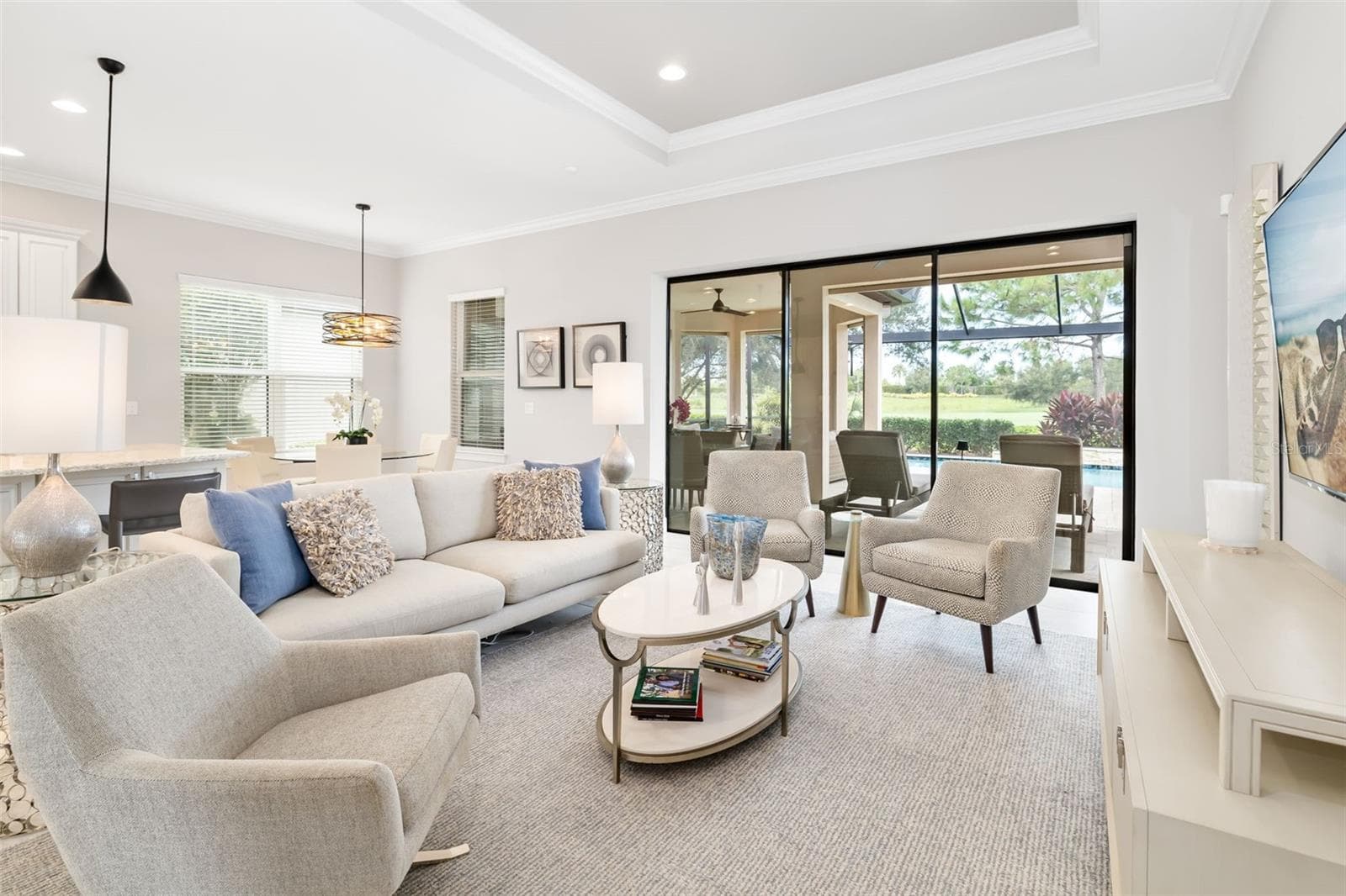 The view of the lanai is through three stackable sliding dooors - 12807 SORRENTO WAY, BRADENTON