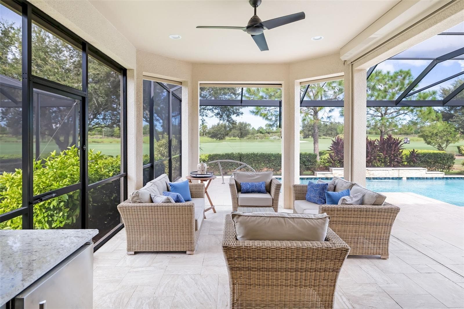 An under-roof expanded seating area - 12807 SORRENTO WAY, BRADENTON