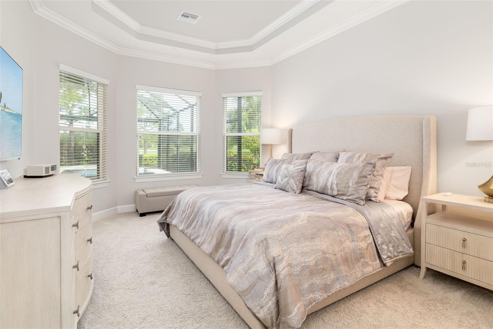 The primary bedroom features beautiful tray ceilings with crown molding and a three bedroom bay window area. Bedroom easily accommodates a king-size bed - 12807 SORRENTO WAY, BRADENTON