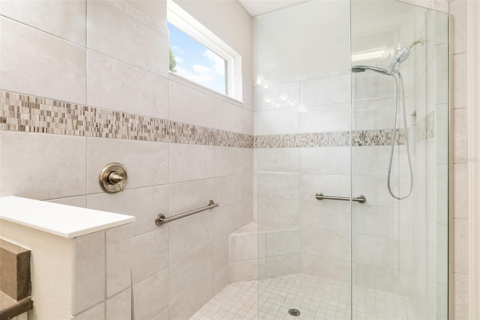 Primary shower is large and the window provide natural light - 12807 SORRENTO WAY, BRADENTON