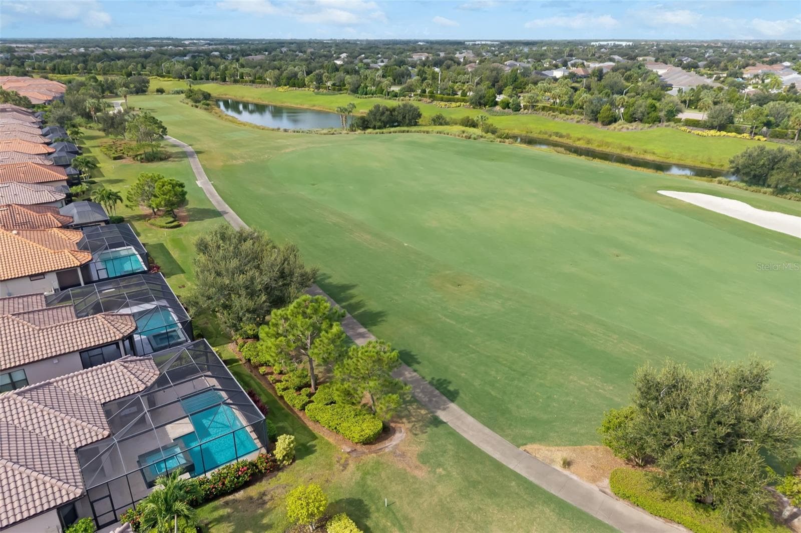 Home with view of part of the 11th fairway - 12807 SORRENTO WAY, BRADENTON