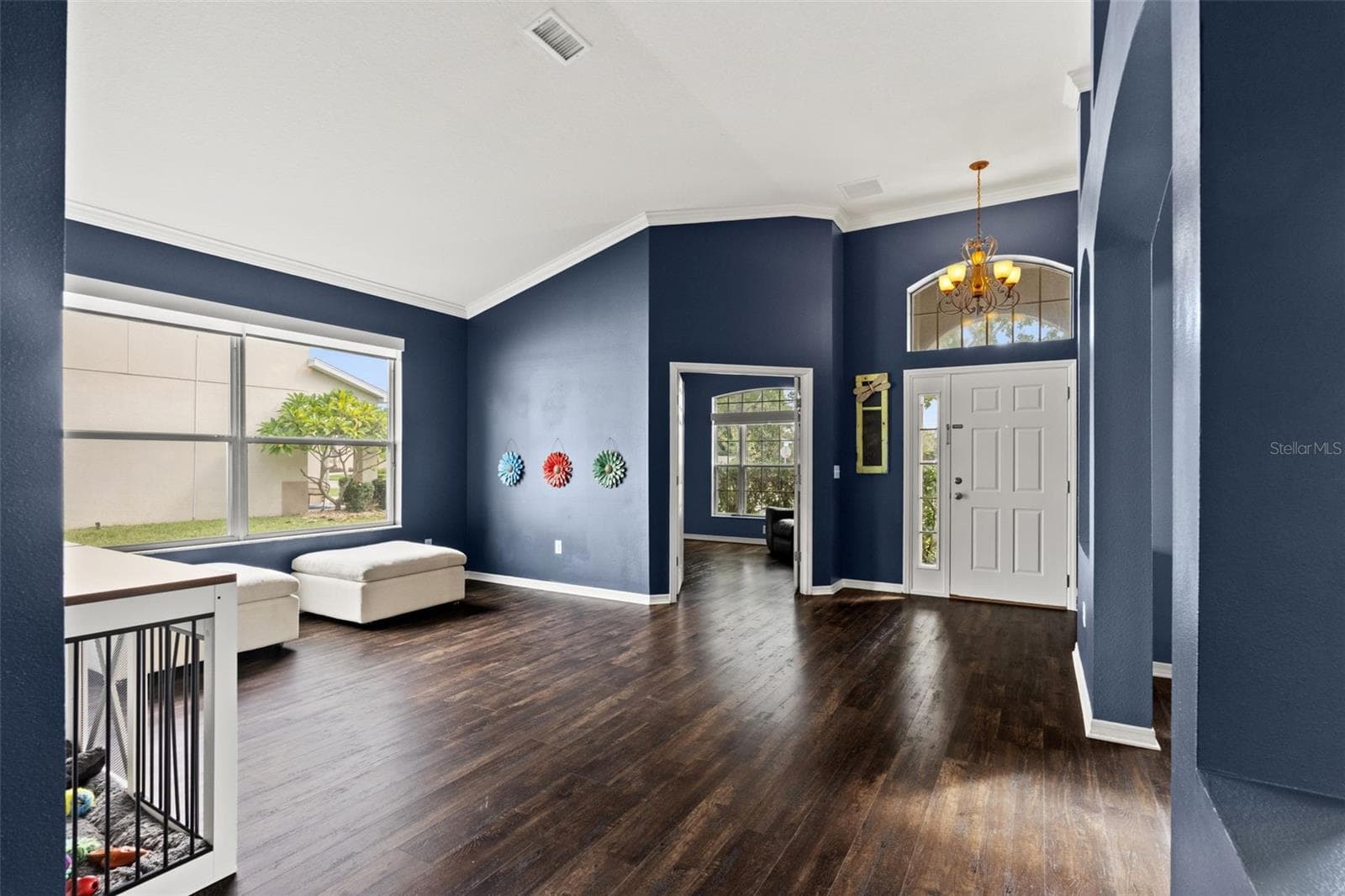 The front living area offers flexible space for entertaining, relaxing, or creating an additional conversation area. - 1419 BLUE MARLIN BLVD, HOLIDAY
