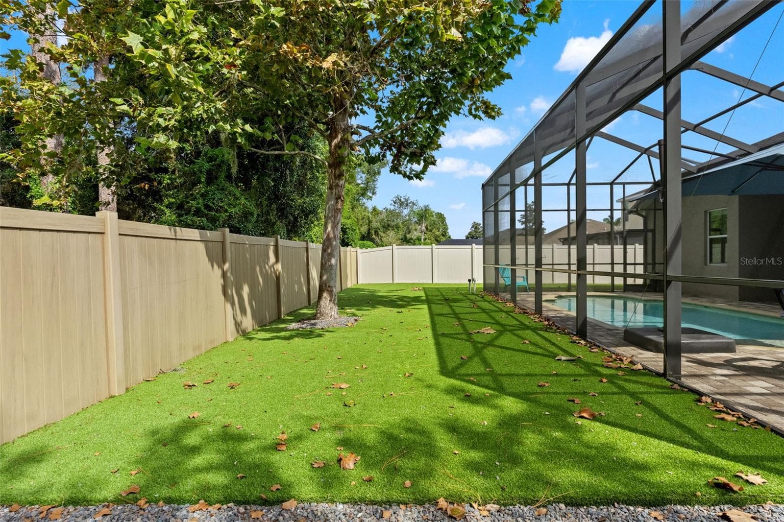 Pet-safe turf creates a clean, low-maintenance yard where four-legged family members have room to run. - 1419 BLUE MARLIN BLVD, HOLIDAY