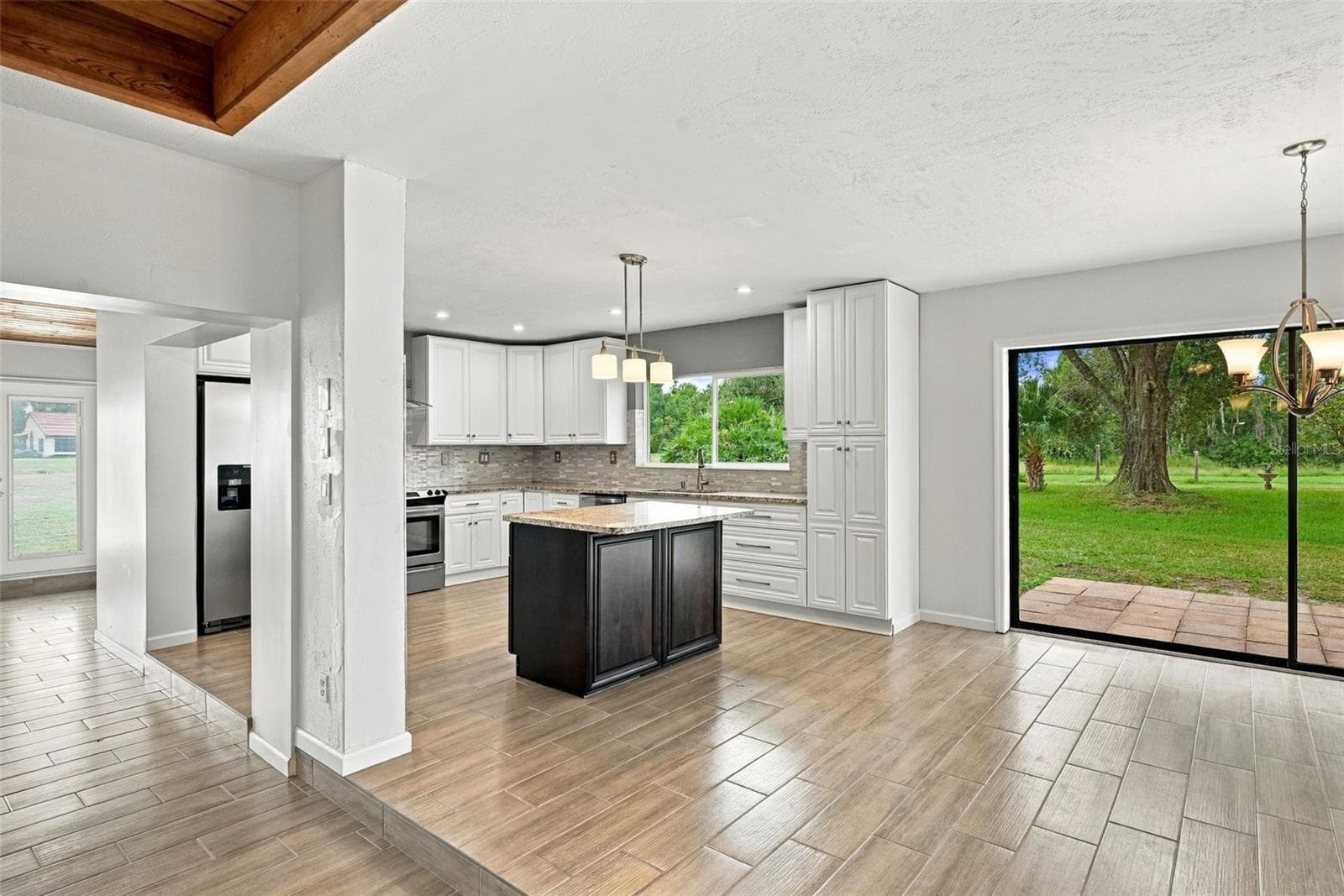 Sliding door to patio - 15 ABBEY CT, HAINES CITY