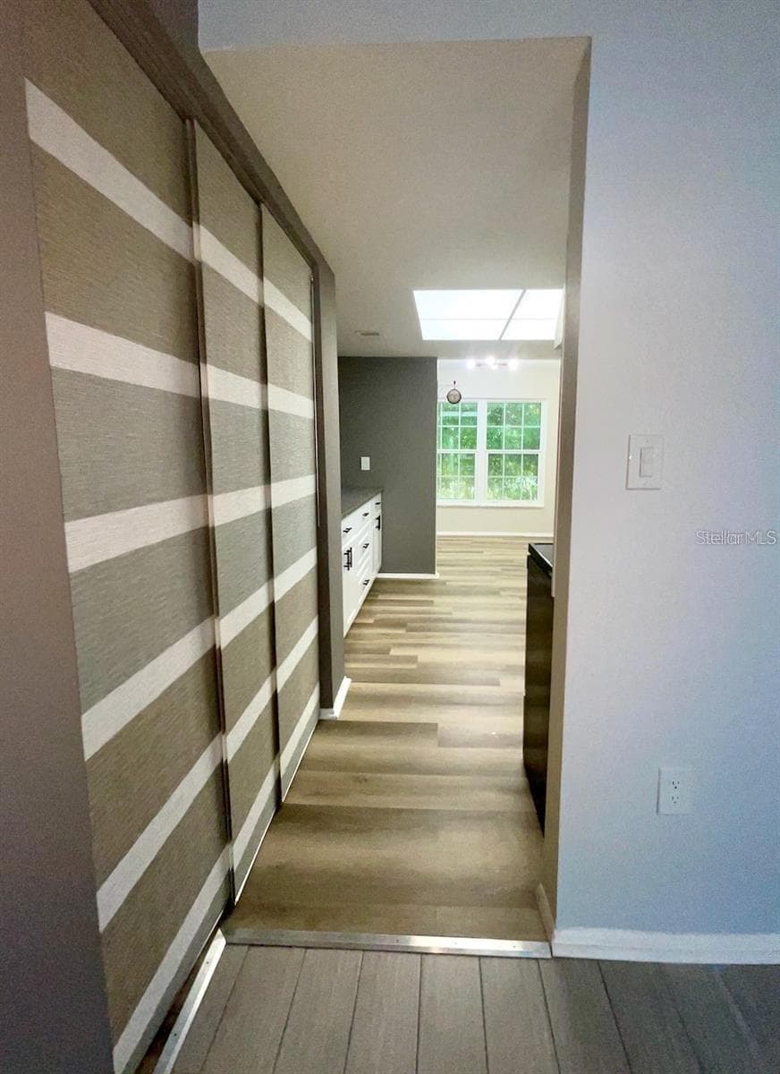 Pantry closet and doorway to kitchen from dining area - 1020 85TH AVE N #222, ST PETERSBURG