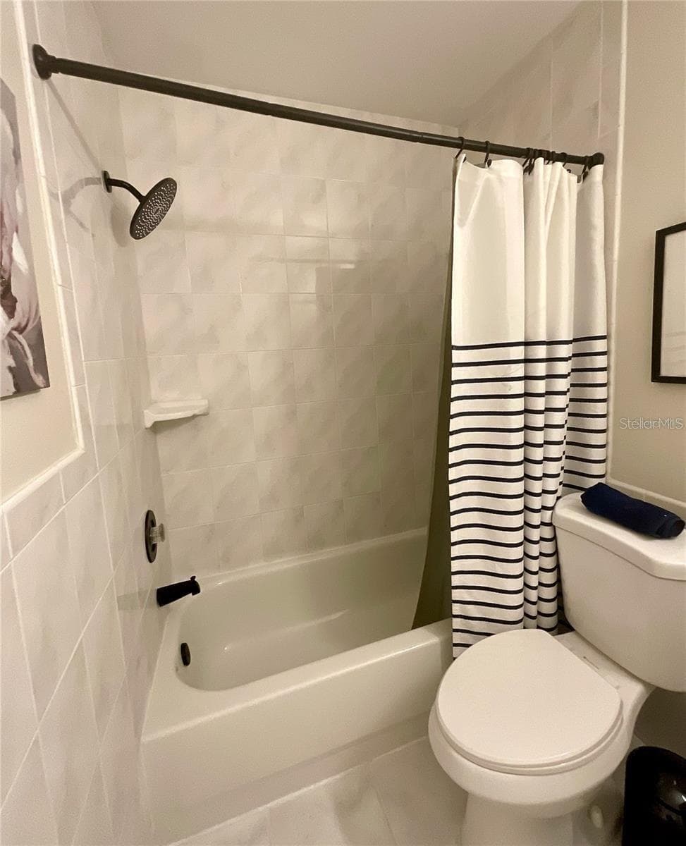 Bathroom tub and shower. - 1020 85TH AVE N #222, ST PETERSBURG