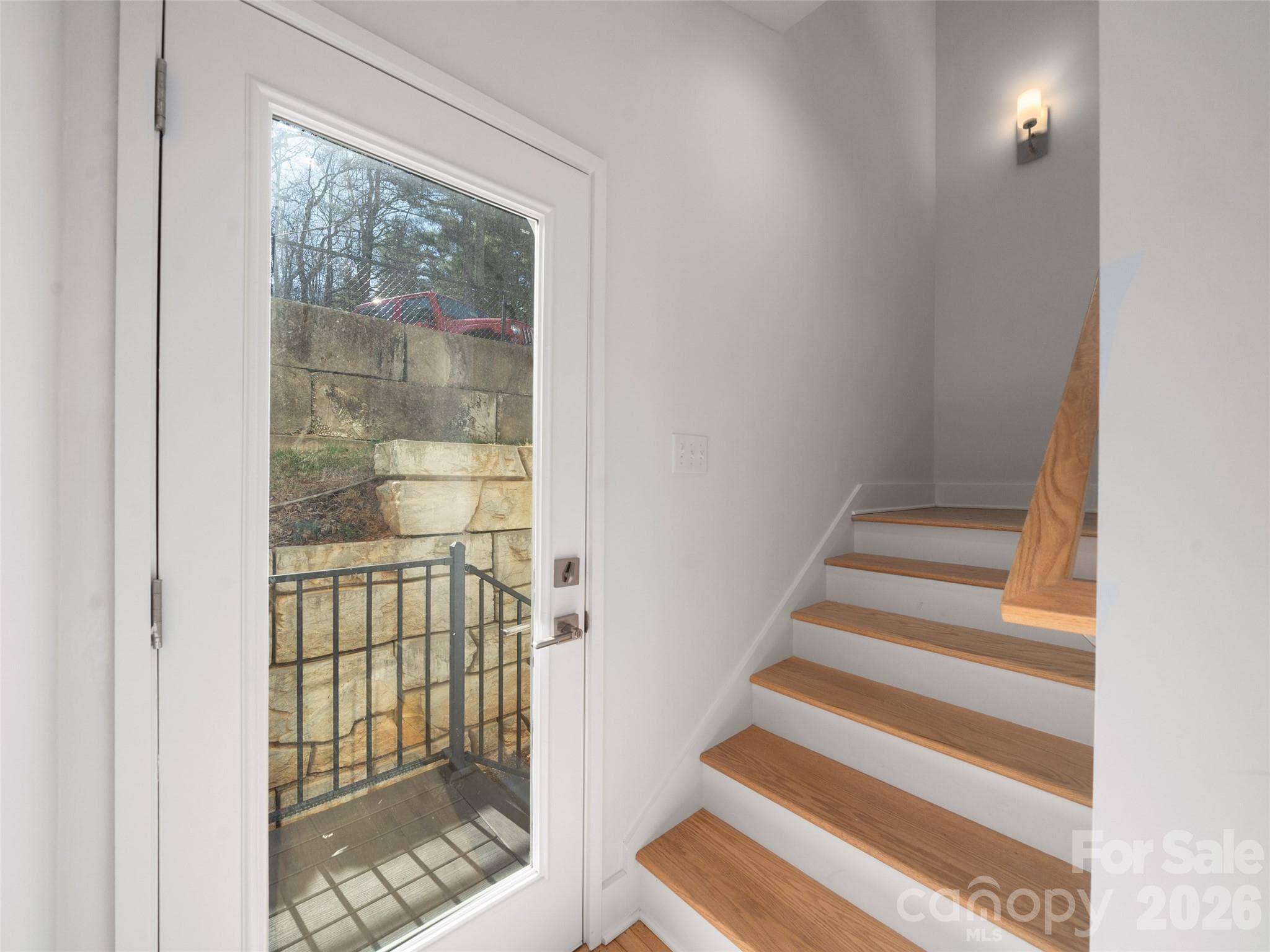 Staircase to the upper level just past the elevator - 43 Skyvue Court, Saluda