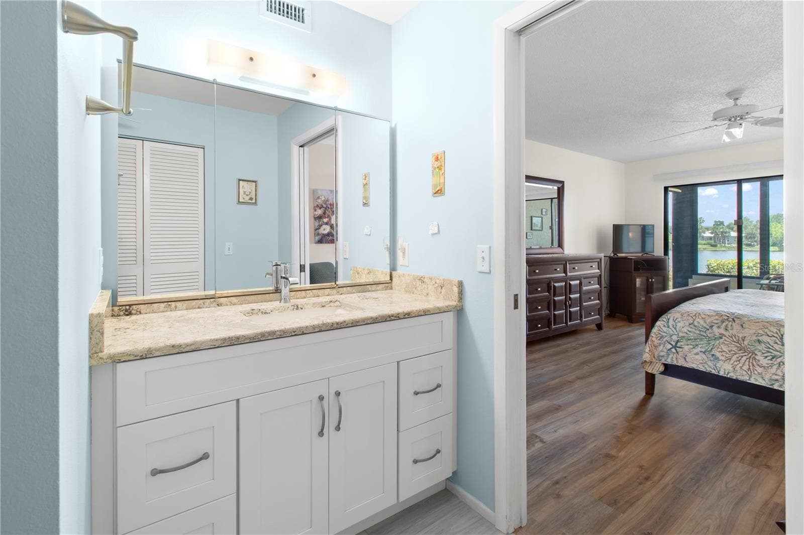 Primary bath and bedoom. - 220 LAKEWOOD DR #220, BRADENTON