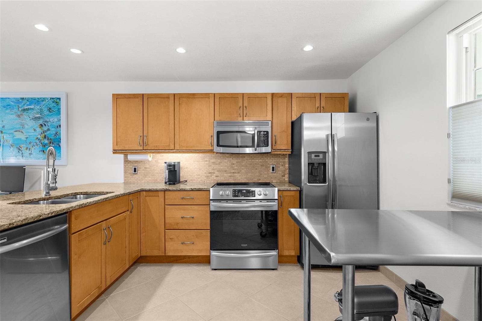 Wood cabinets adding a coastal vibe - 600 SUTTON PL #101B, LONGBOAT KEY