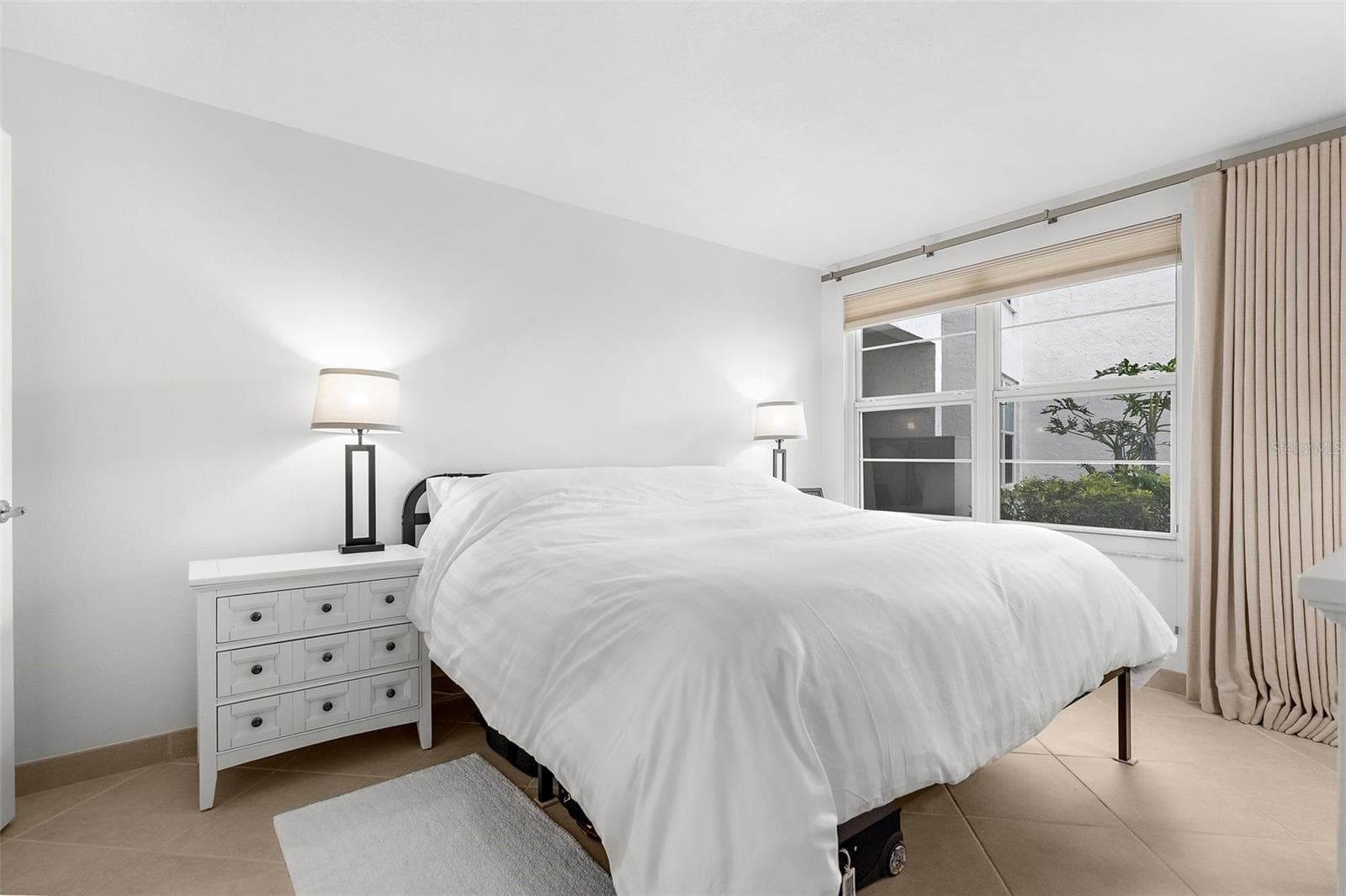 Primary Bedroom. Goodnight after a long day by the pool or at the beach - 600 SUTTON PL #101B, LONGBOAT KEY