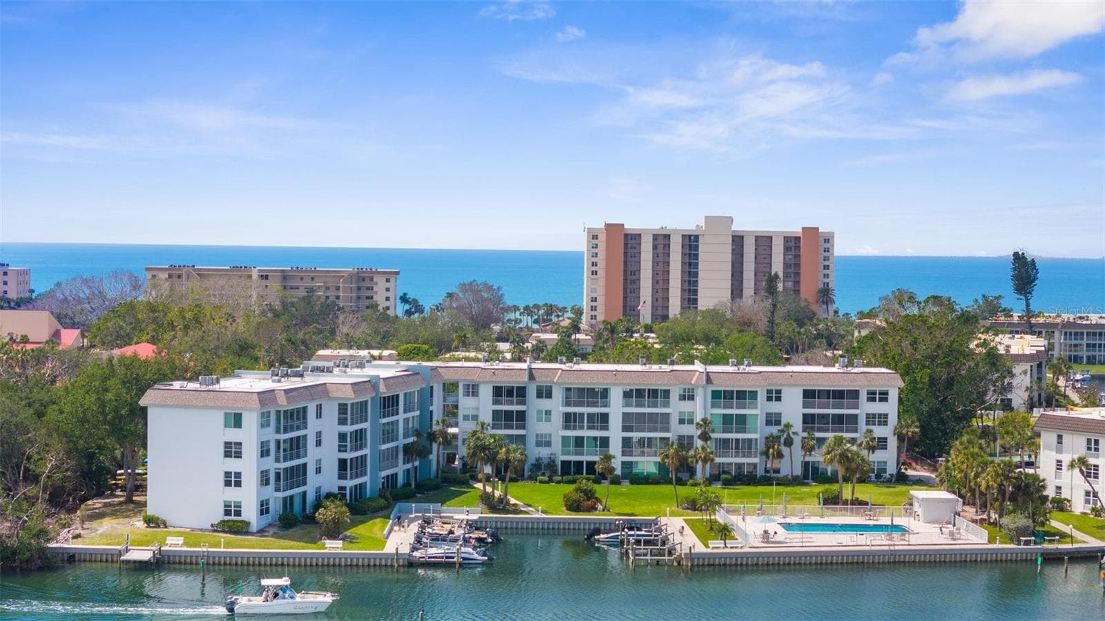 Aerial View of Association with boat docks, pool, electric kayak launch - 600 SUTTON PL #101B, LONGBOAT KEY