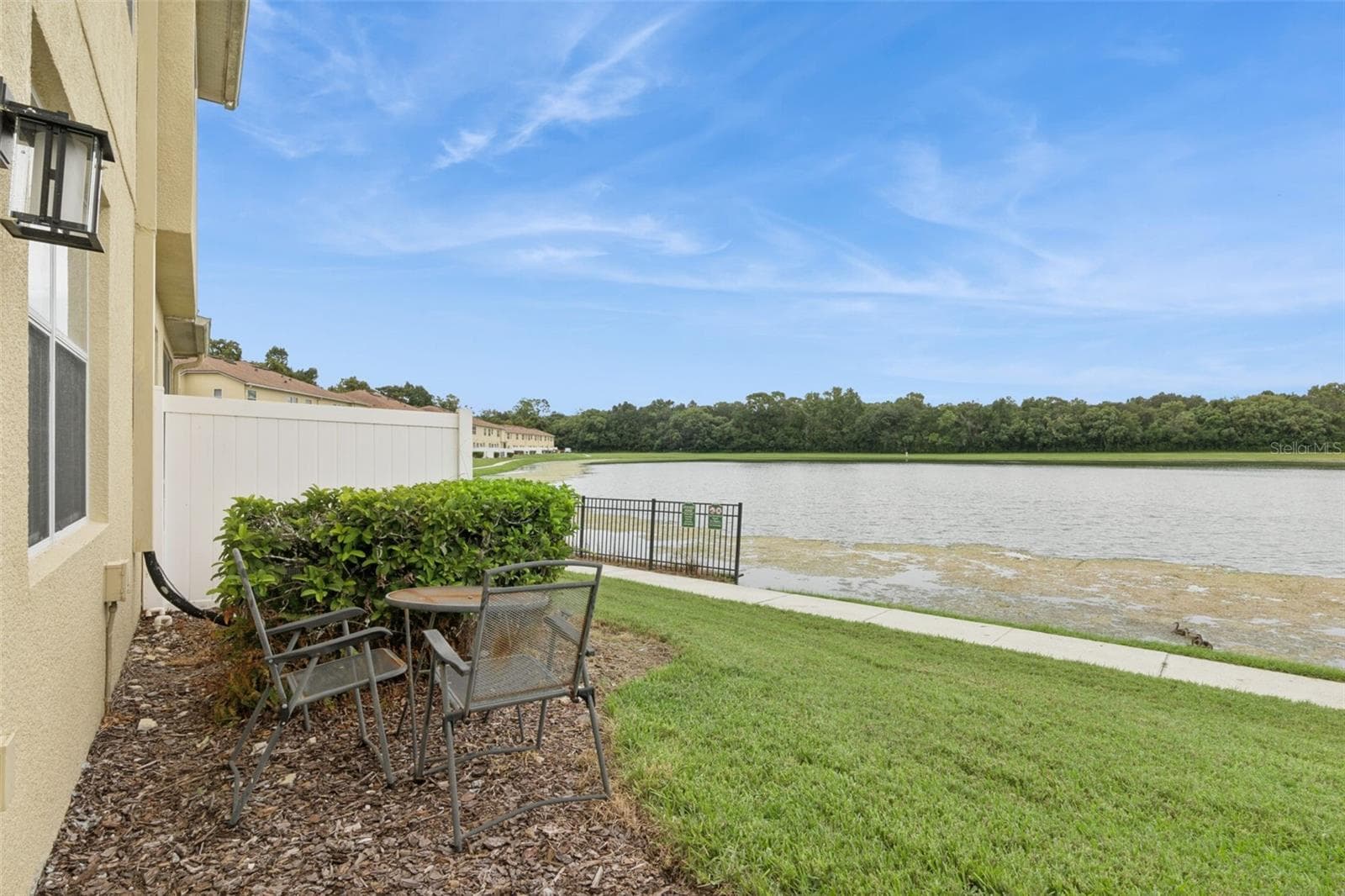 Rear Exterior with Lake View - 3853 GLIDING PL, SANFORD