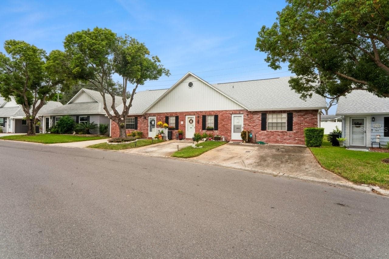 TThe unit is located on the far-left side, and being an end unit, it has more windows. - 6709 DEVONSHIRE LN #10A, NEW PORT RICHEY