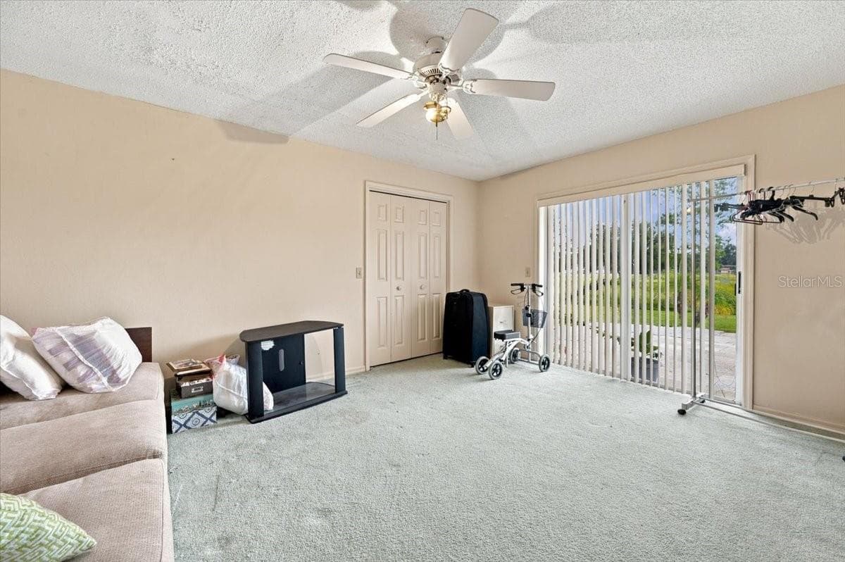 Bedroom 3 with sliding doors to rear patio - 4437 FLINTLOCK LOOP, LAKELAND