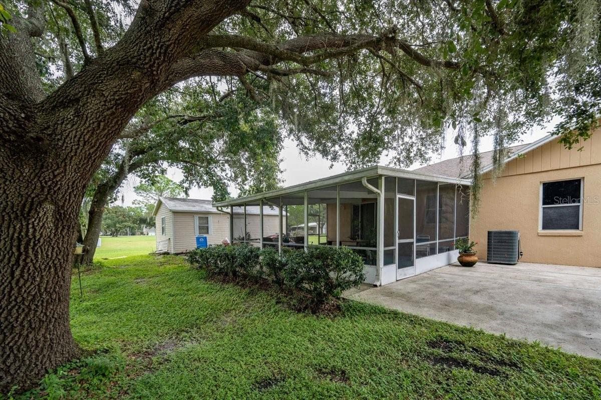 Side screened lanai & storage shed - 4437 FLINTLOCK LOOP, LAKELAND