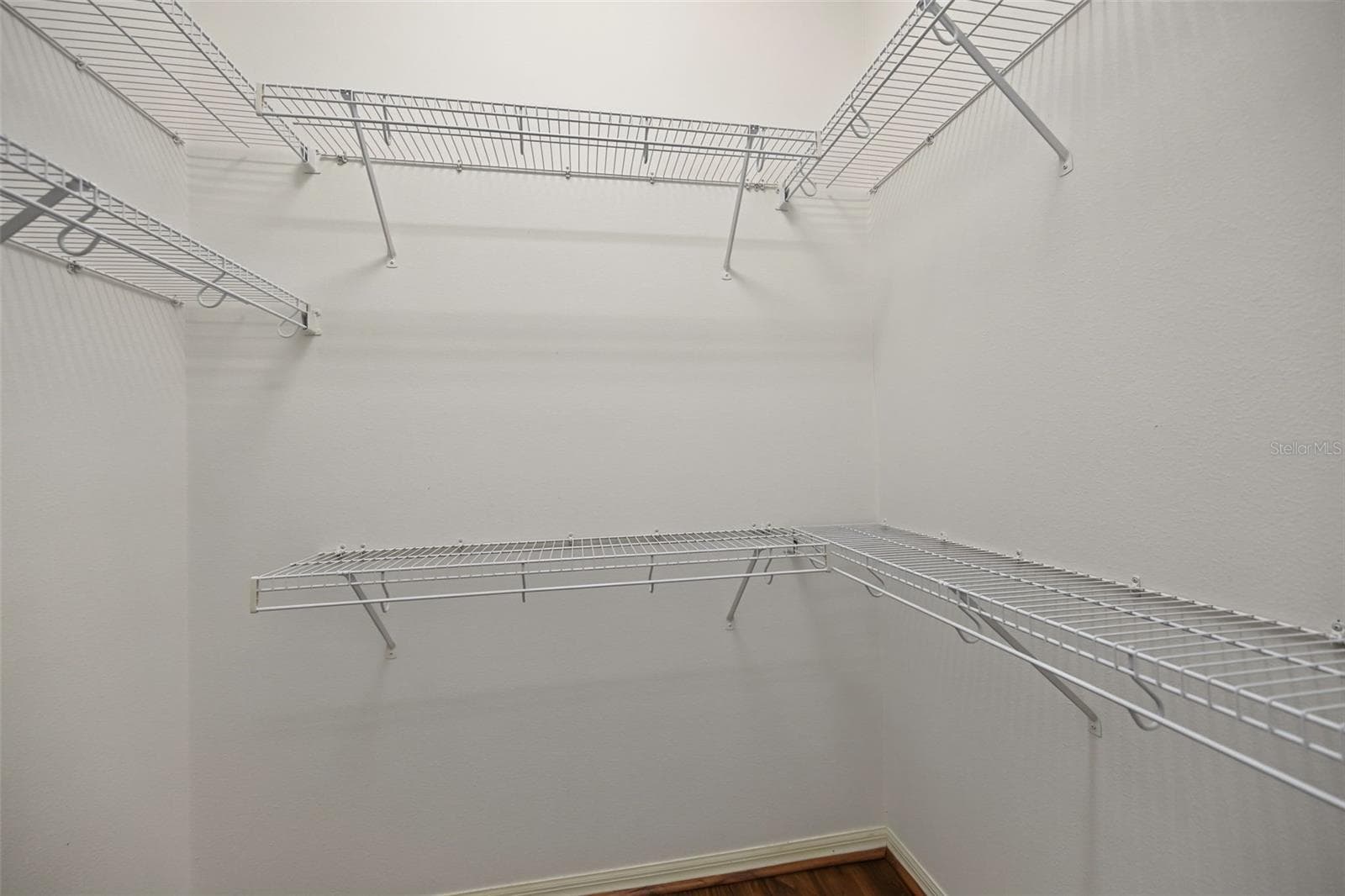 One of two walk-in closets in primary bedroom - 1028 HAGEN DR, NEW PORT RICHEY