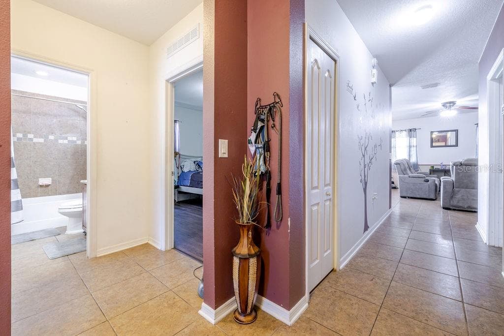 Entrance from foyer. 2 bedrooms and guest bathroom on the left. - 252 SHERRI LEE LN, DELAND