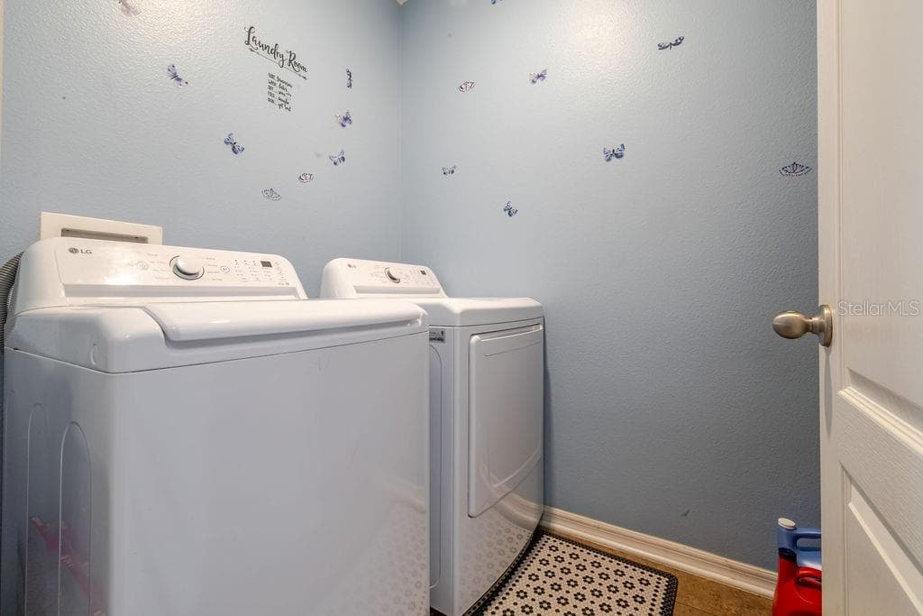 Inside laundry room and washer and dryer convey with home - 252 SHERRI LEE LN, DELAND