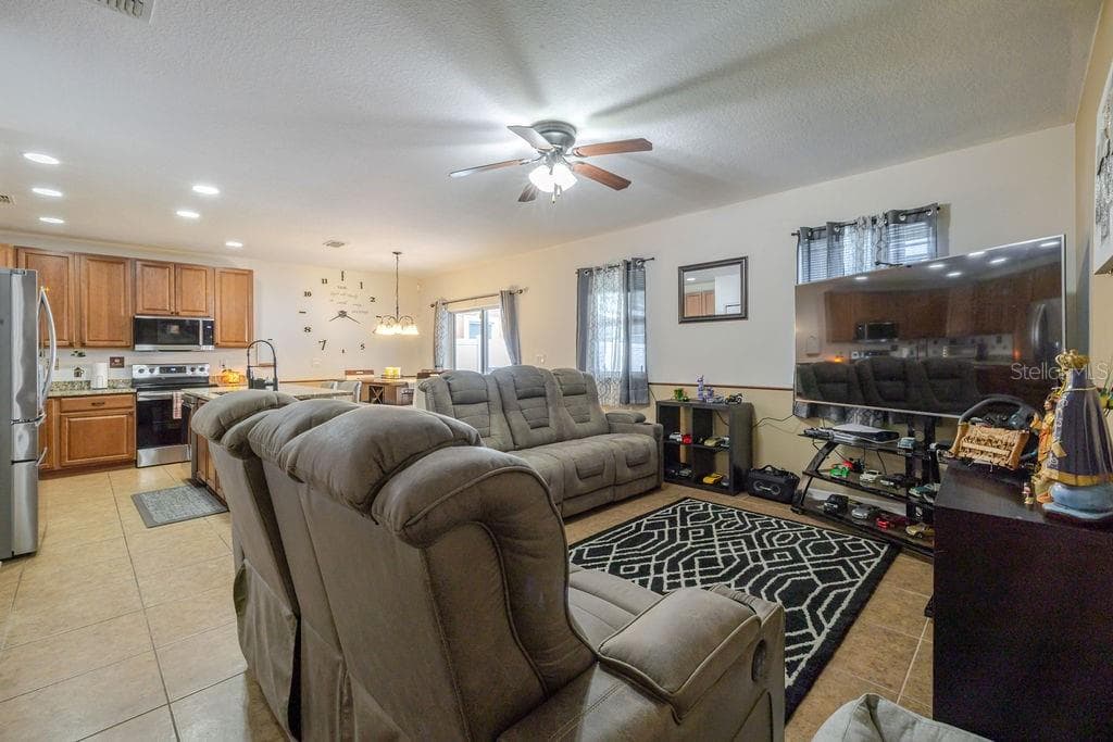 Living room opens to dining room - 252 SHERRI LEE LN, DELAND
