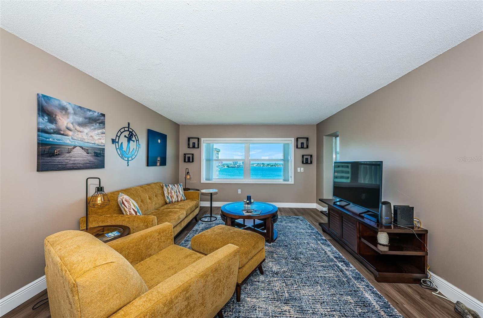 Living room with views of the Intracoastal and the Gulf - 4575 COVE CIR #1003, ST PETERSBURG