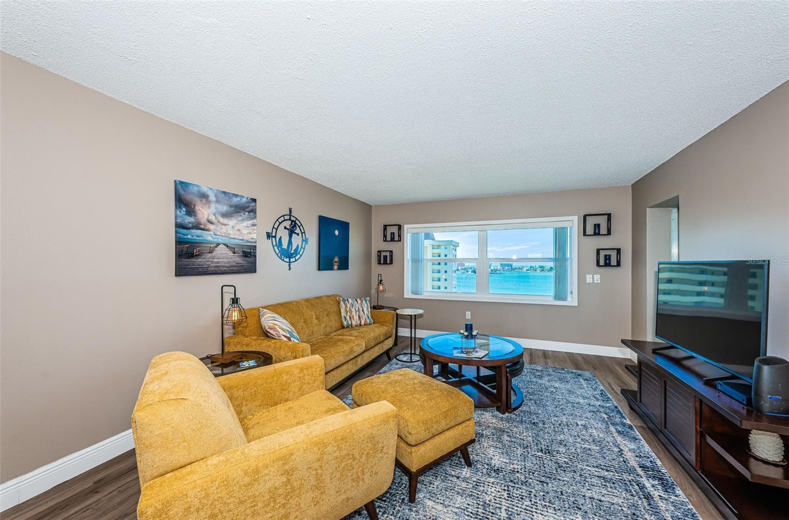 Living room with water views of the Intracoastal and Gulf - 4575 COVE CIR #1003, ST PETERSBURG
