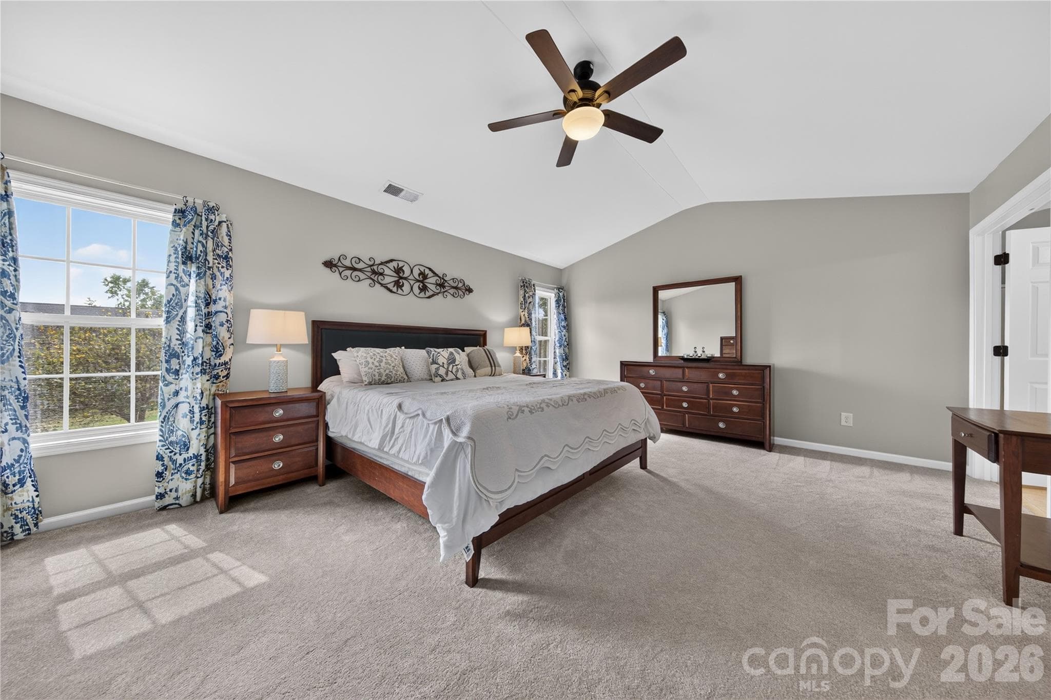 Expansive, primary bedroom with vaulted ceiling and ensuite bathroom - 5725 Lindley Crescent Drive, Indian Trail