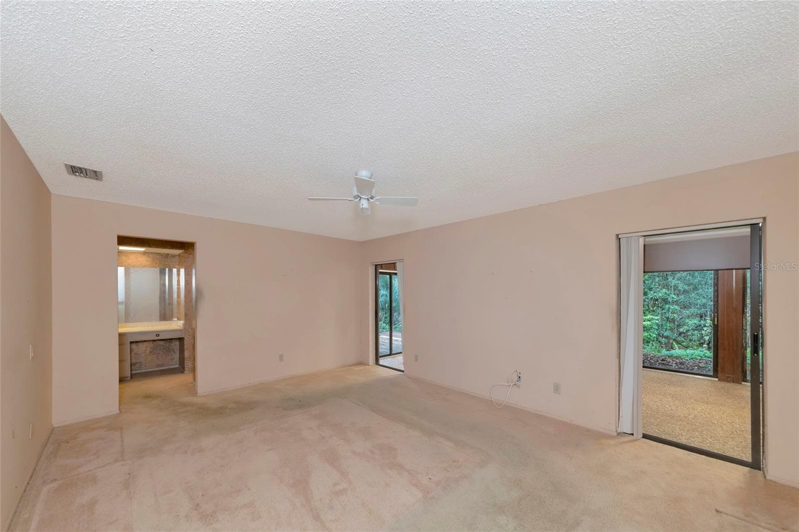 Primary Bedroom with 2 Sets of Sliders to the Florida Room - 4781 STONE RIDGE TRL, SARASOTA
