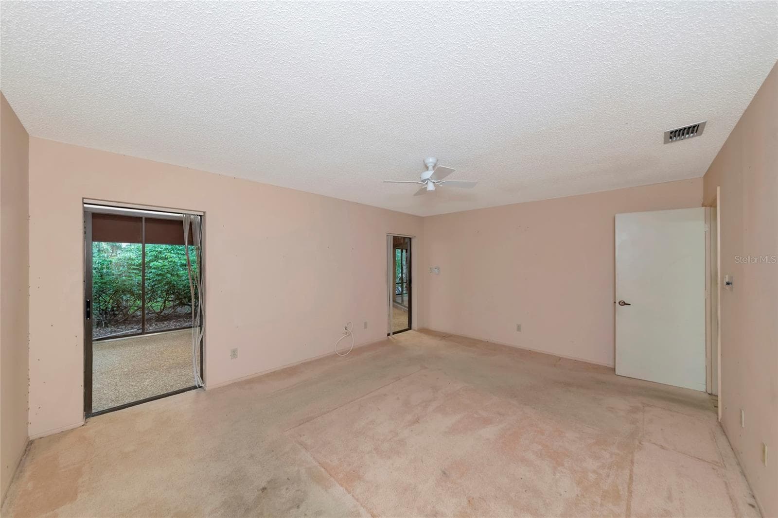 Primary Bedroom with 2 Sets of Sliders to the Florida Room - 4781 STONE RIDGE TRL, SARASOTA
