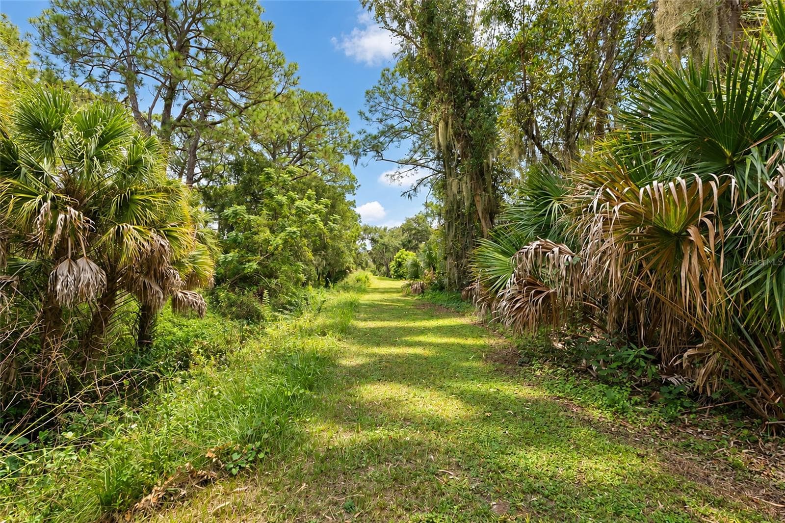 The 1 Acre Homesite Backs up to a Sarasota County Drainage Easement, which makes the Property Even More Private. - 4781 STONE RIDGE TRL, SARASOTA