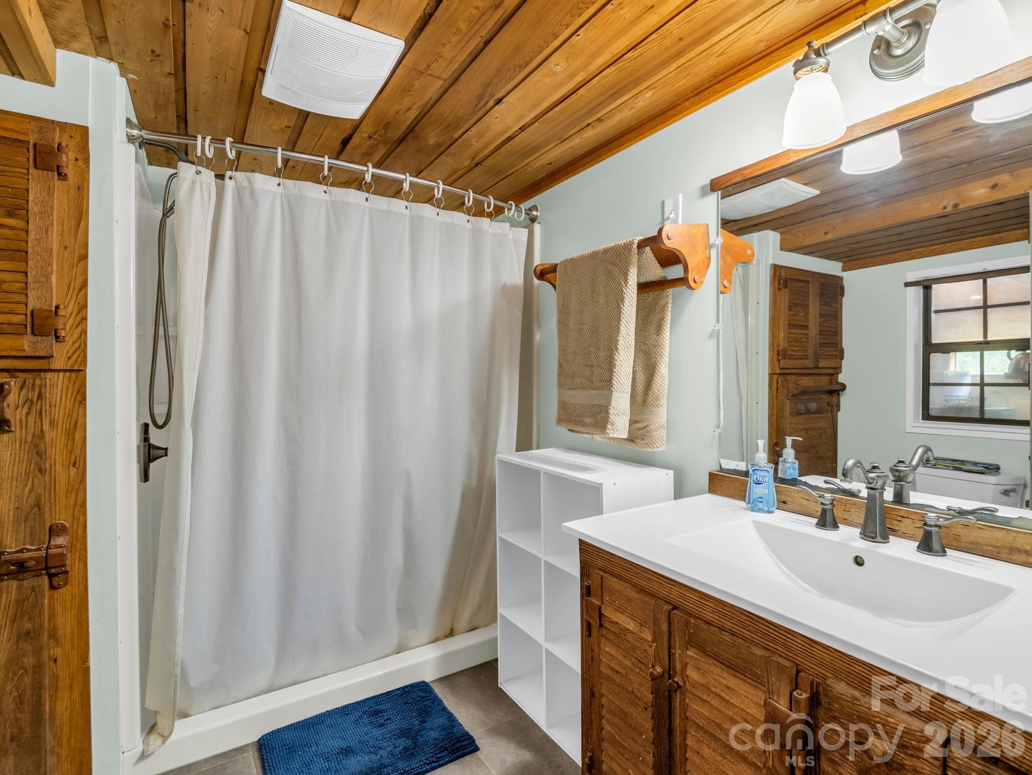 Full bathroom off of mud room/laundry room - 765 Hawk Ridge Lane, Marshall