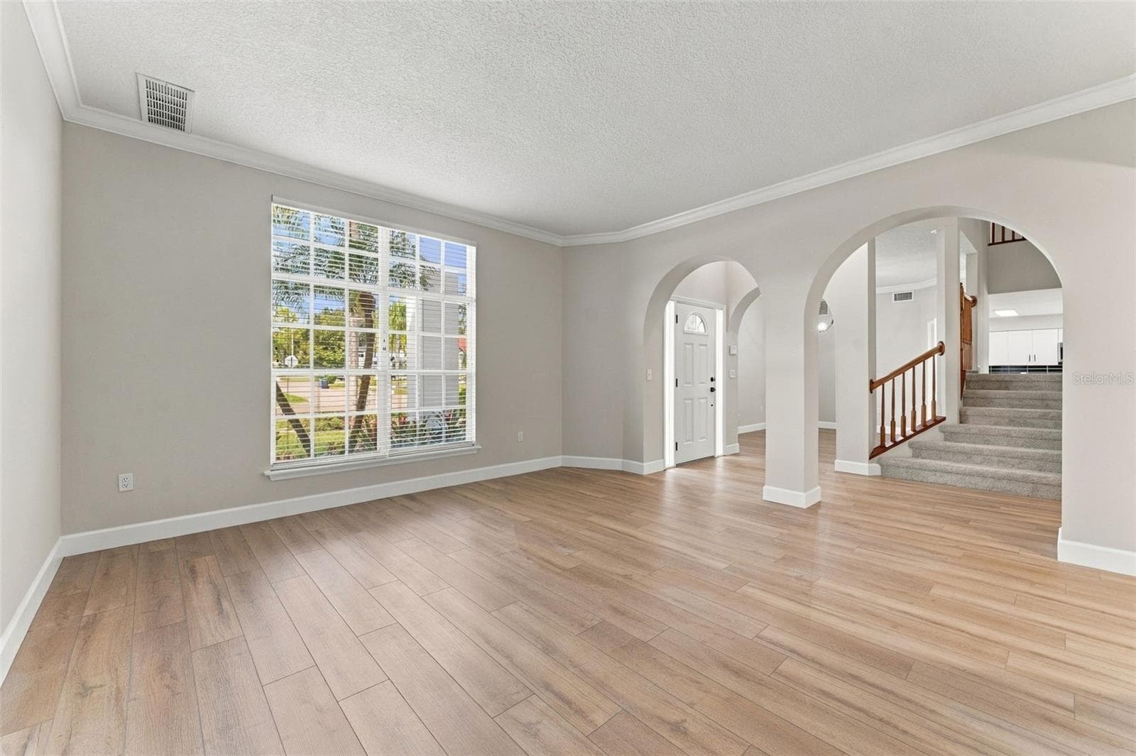 Located right off the front door is the formal living room - 10102 VISTA POINTE DR, TAMPA