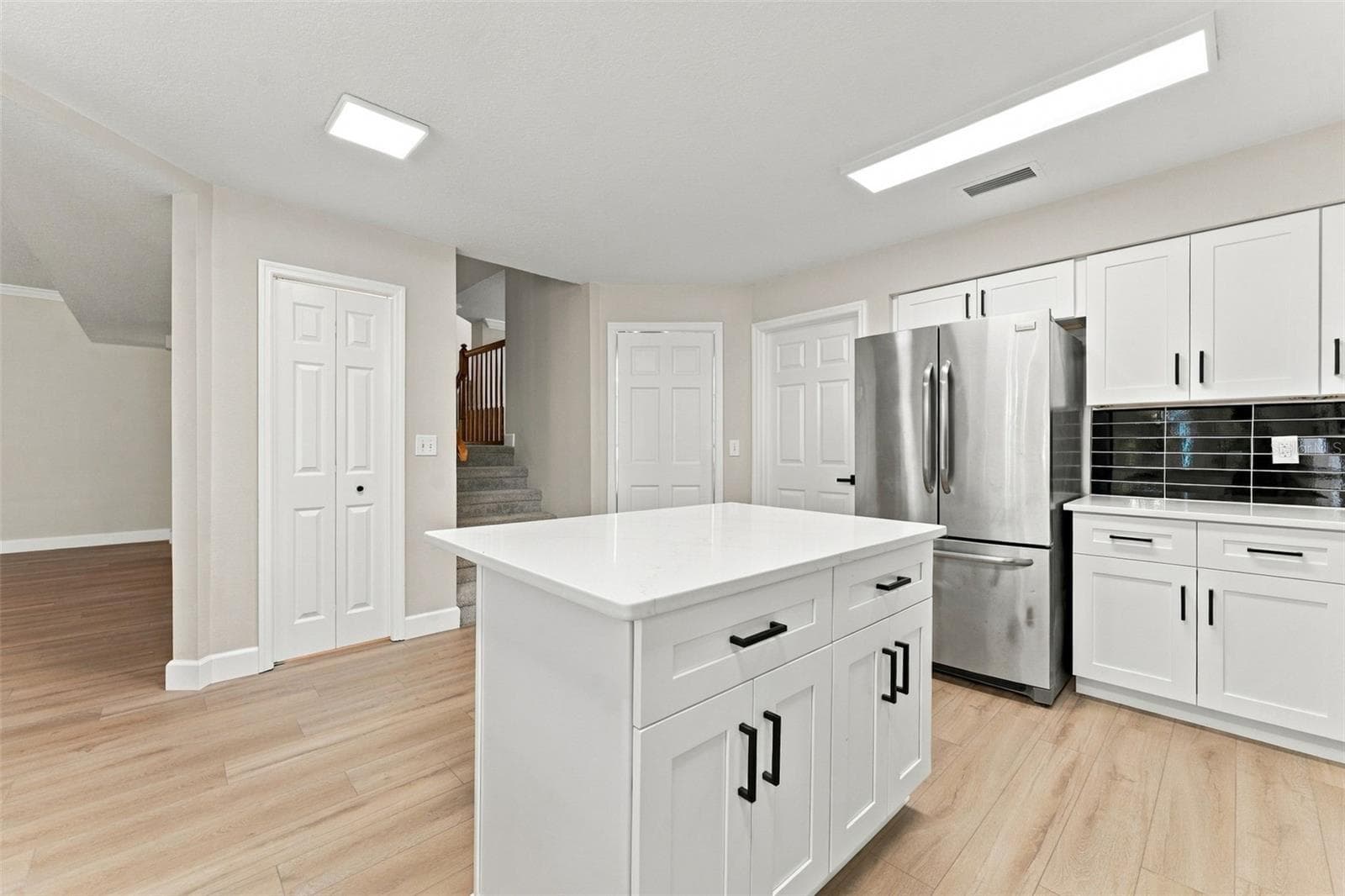 Kitchen island and closet pantry allow even more space for storage - 10102 VISTA POINTE DR, TAMPA