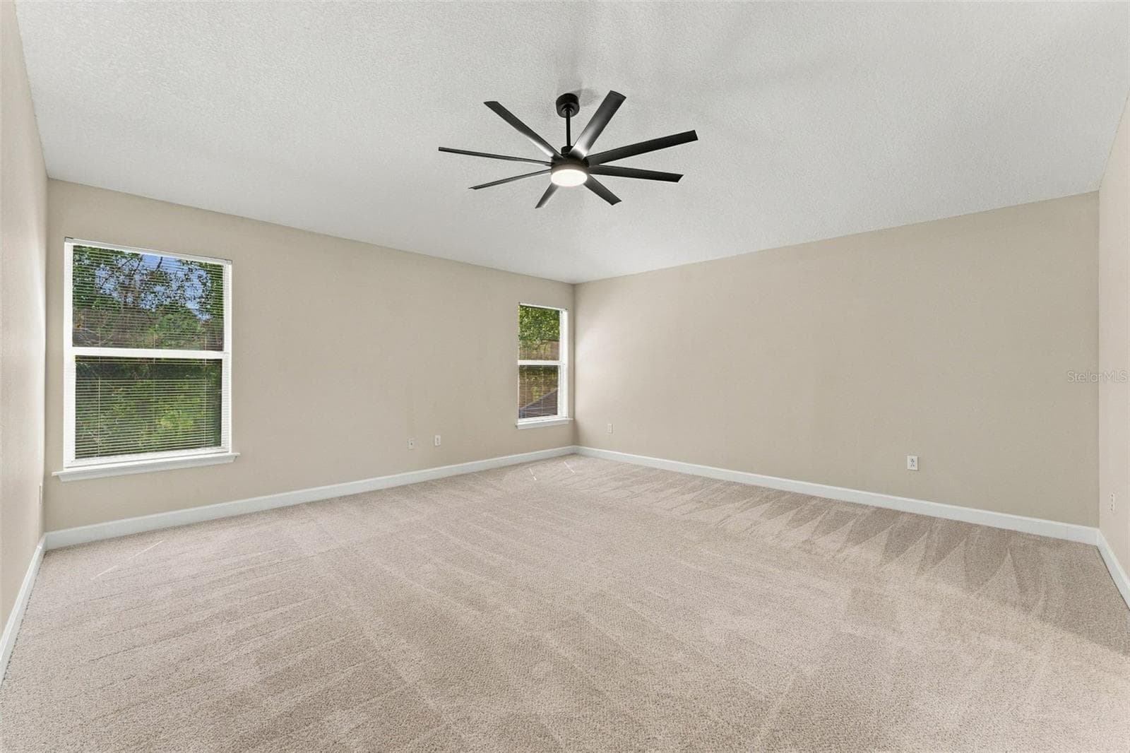 Primary bedroom is very spacious and tucked in the corner for your own private retreat - 10102 VISTA POINTE DR, TAMPA