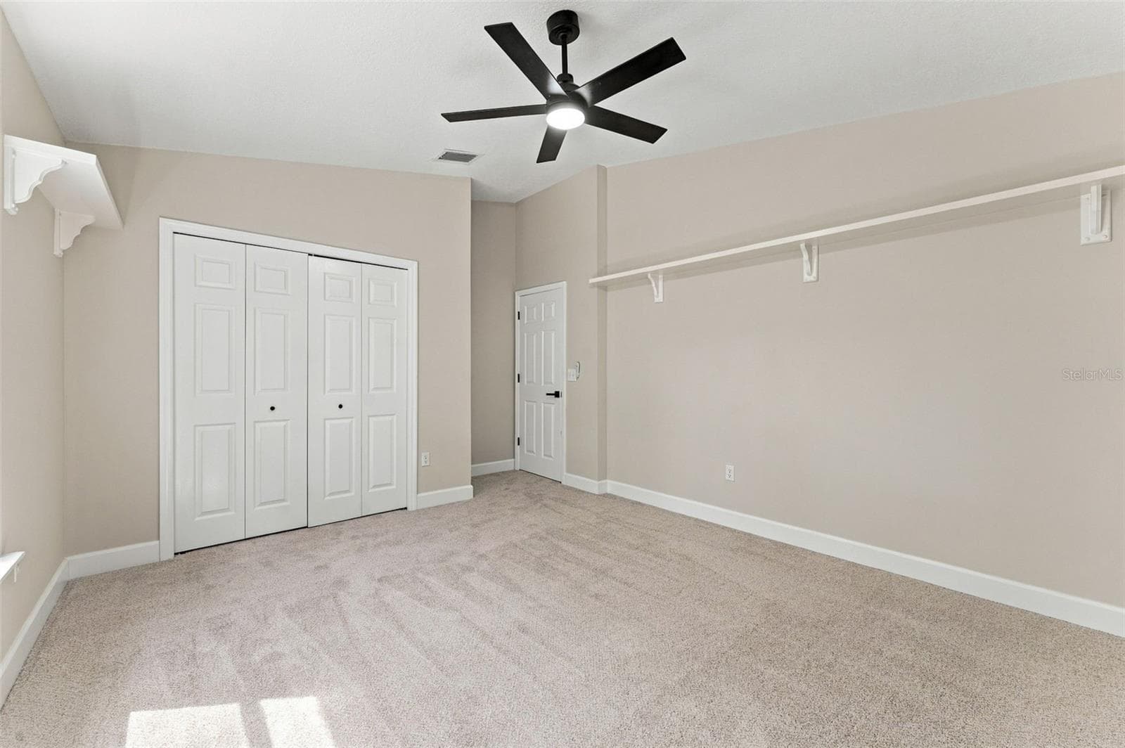 Bedroom 2 with a large wall closet and plenty of space - 10102 VISTA POINTE DR, TAMPA