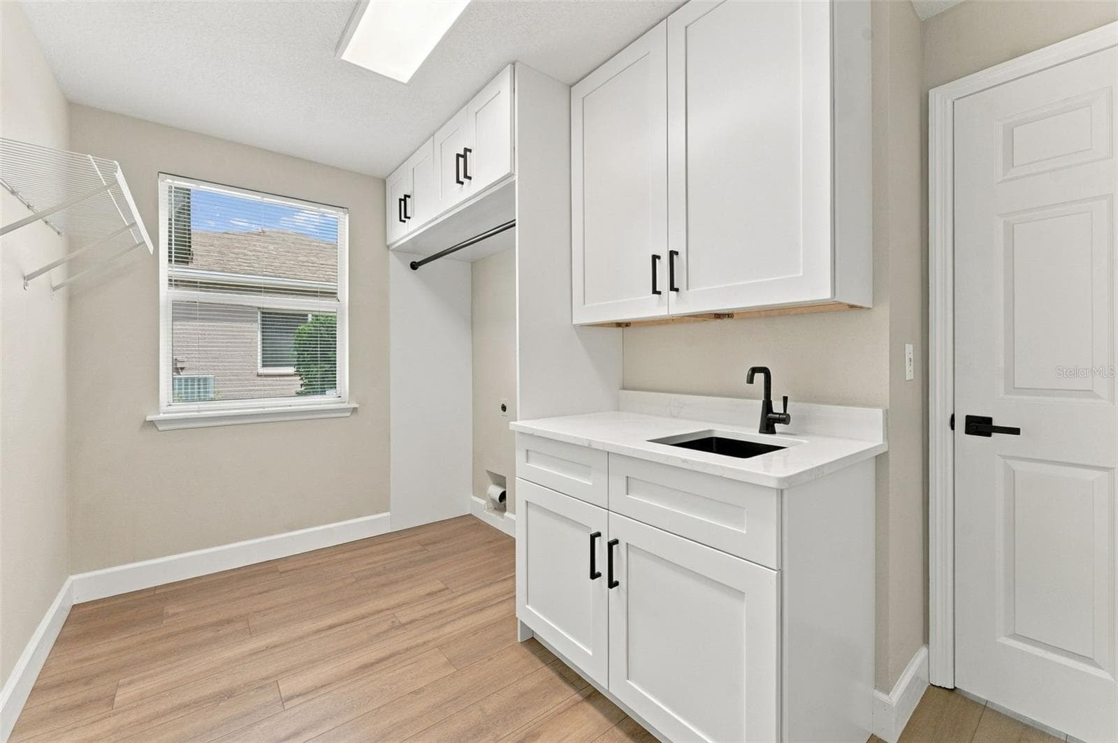 New cabinets. countertops and storage designed into your brand new laundry room - 10102 VISTA POINTE DR, TAMPA