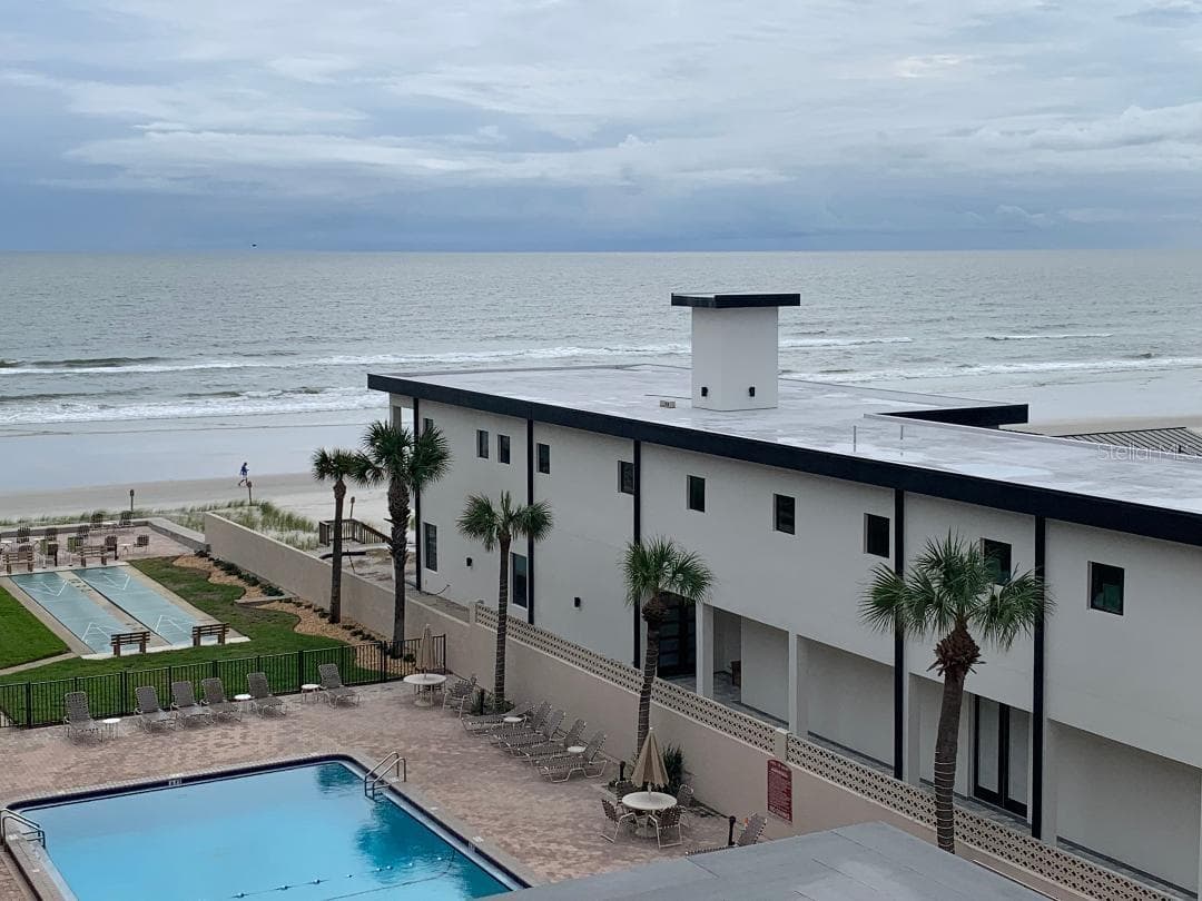 View from balcony with new home next door. - 4301 S ATLANTIC AVE #504, NEW SMYRNA BEACH