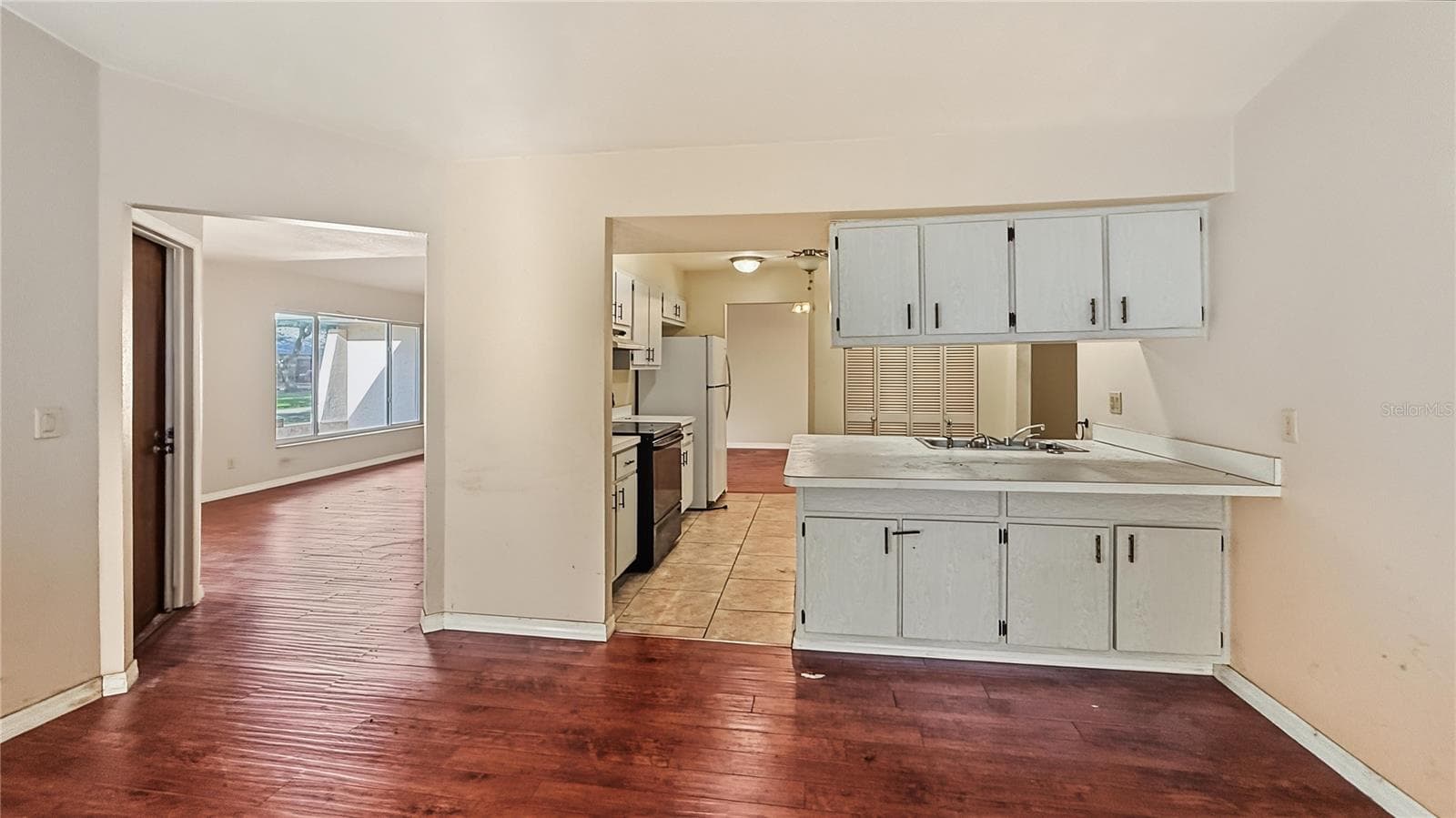 great room looking at kitchen - 22293 ADORN AVE, PORT CHARLOTTE