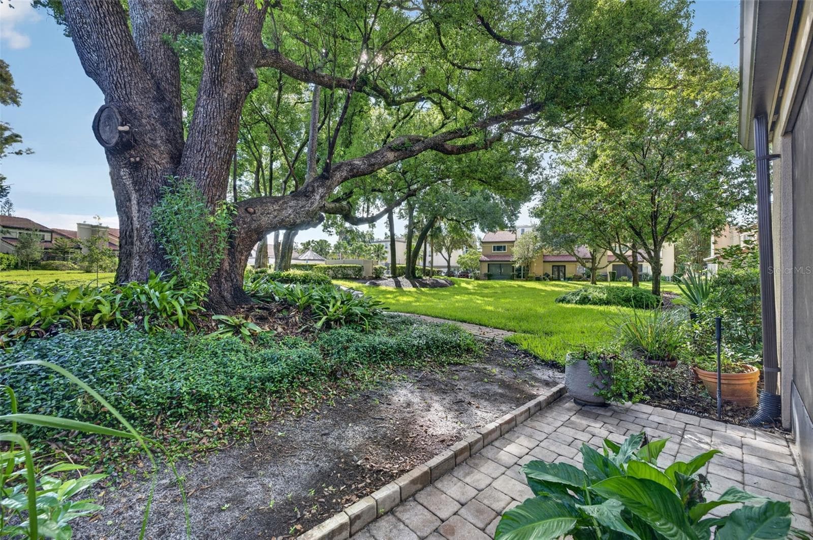 PAVED AREA OUTSIDE SCREENED LANAI - 223 QUAYSIDE CIR #C11, MAITLAND