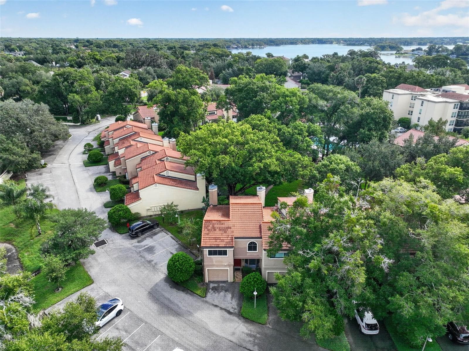AERIAL VIEW OF TOWNHOME, THE COMMUNITY + LAKE MAITLAND - 223 QUAYSIDE CIR #C11, MAITLAND